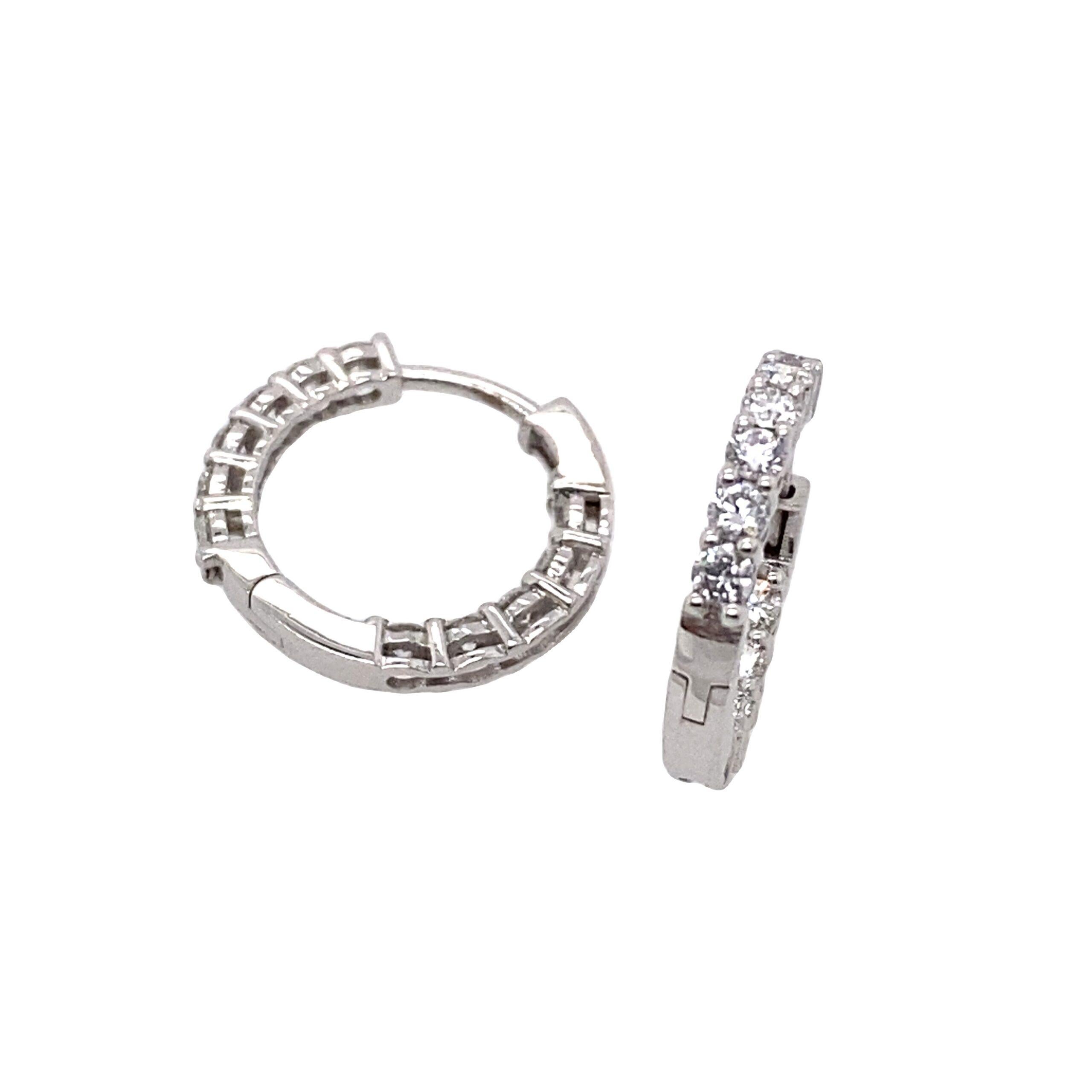18ct White Gold Diamond Hoop Earrings, Set With 11 Diamonds In Each Earring

Additional Information: 
Total Diamond Weight :0.66ct
Diamond Colour: G/H
Diamond Clarity: SI
Total Weight: 2.8g
External Diameter: 15.30mm
Internal Diameter: