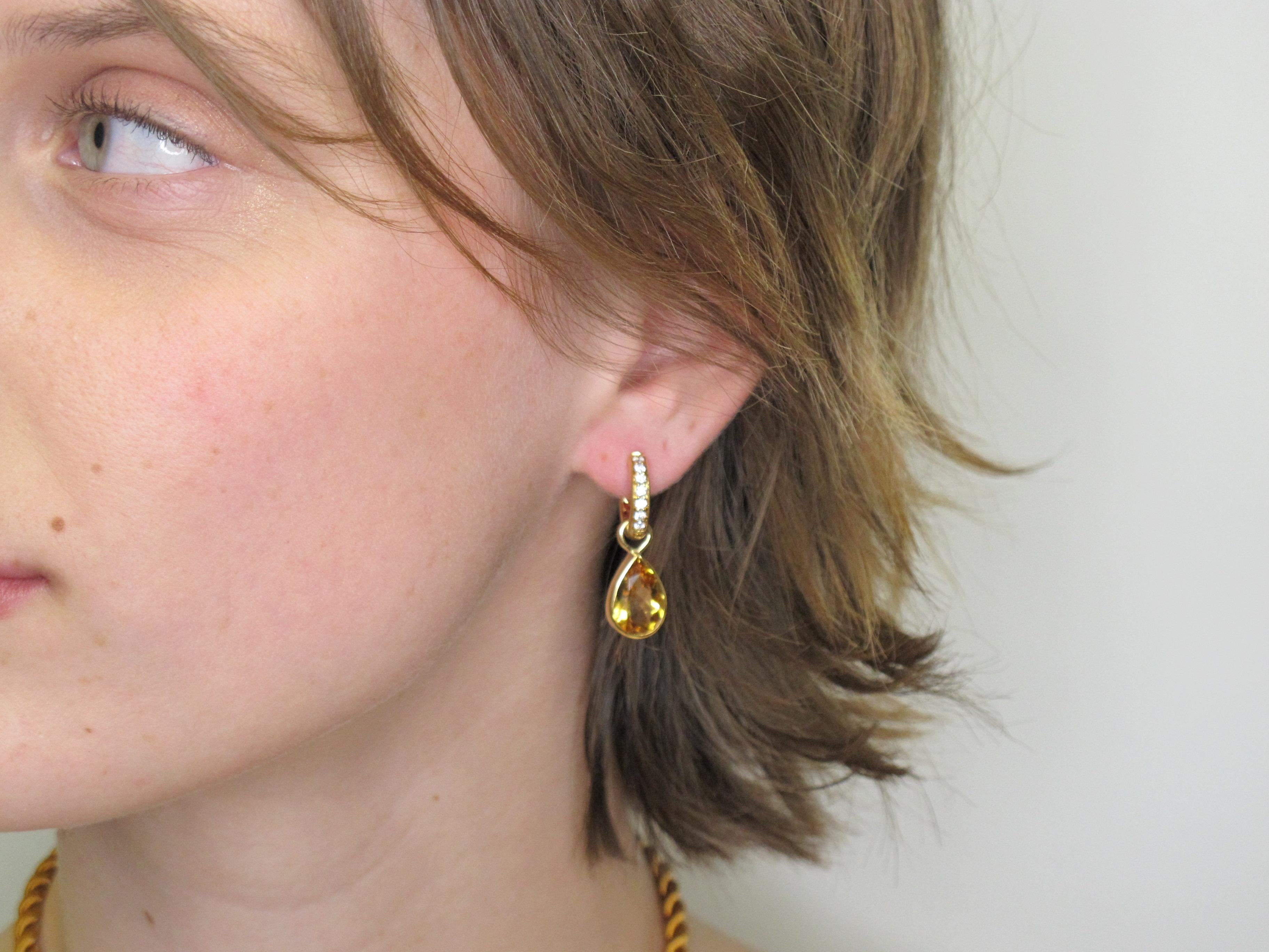 Wear a little sunshine! These earrings are made so that the bezel set citrines can be removed and the hoops can be worn separately but who would want to?? The two pear shape citrines are sparkly and weigh a total of 6.70 carats; the little round