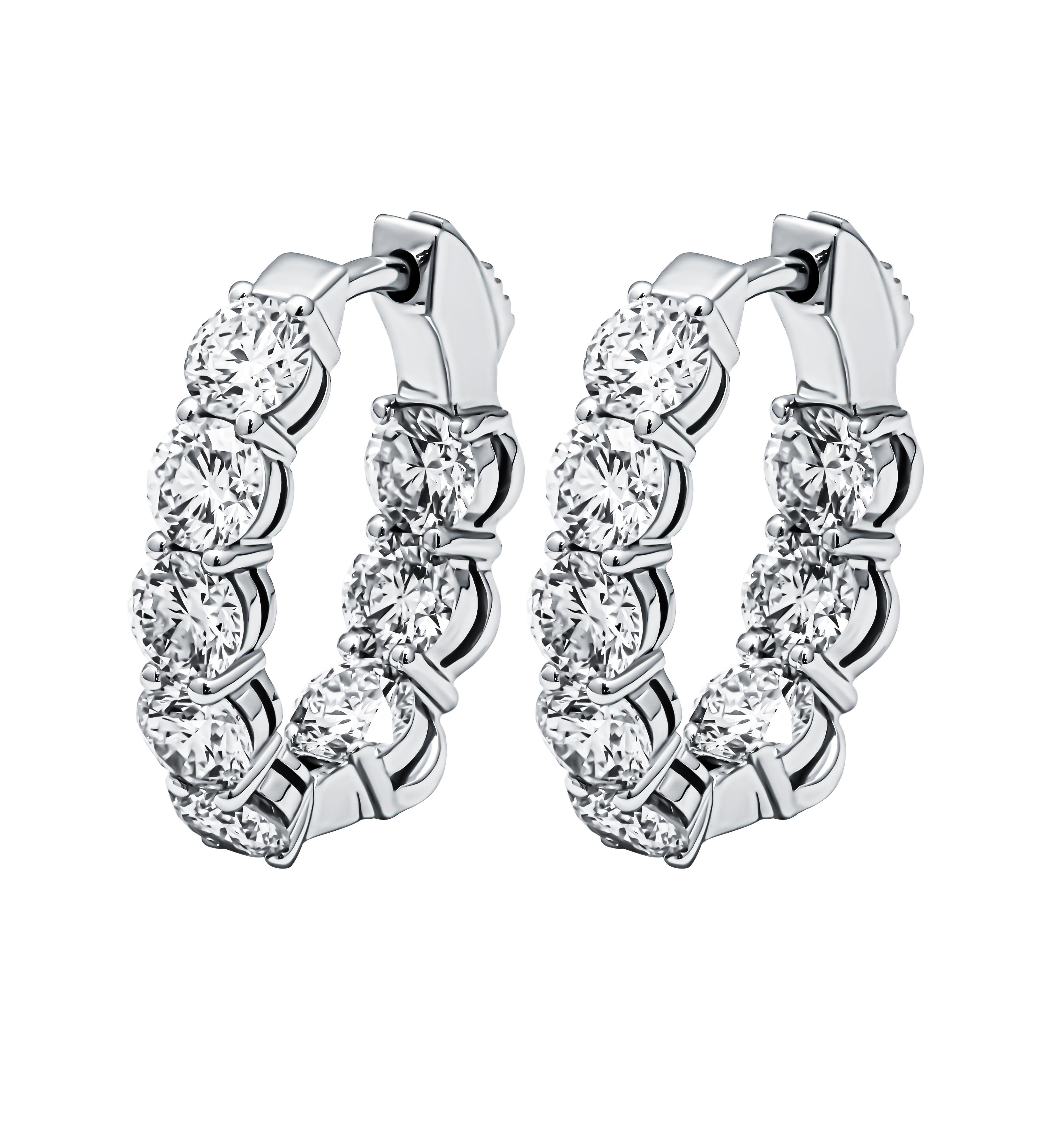 ndulge in timeless elegance with these exquisite 14K White Gold hoop earrings adorned with brilliant round diamonds, totaling an impressive 1.88 carats. Crafted to perfection, these earrings showcase the allure of high-quality diamonds boasting a