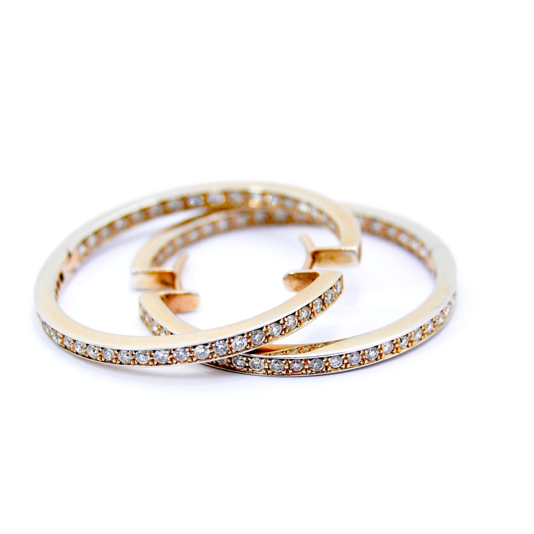 Classic Diamond Hoop Earrings in white and yellow gold
Totalling 1.60ct of diamonds 
And 9.7 gr of gold 
Very good closure and it adapts very well to earlobe