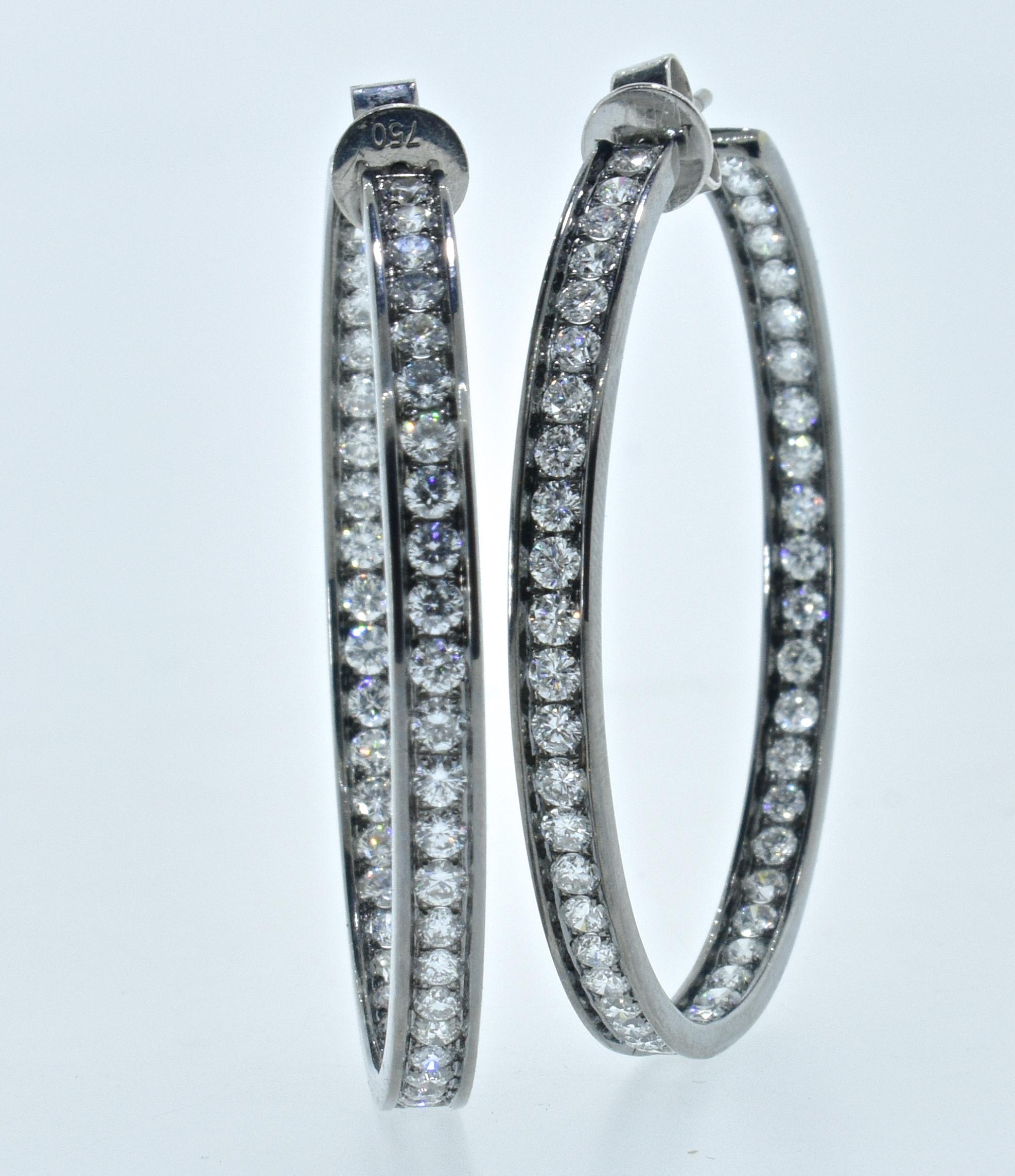 Diamond Hoops with 96 round brilliant cut diamonds amounting to approximately 3.04 cts.  The diamonds are all well matched and well cut and set well in these large hoops.  The diamonds are estimated to be near colorless (G/H), and very to very very