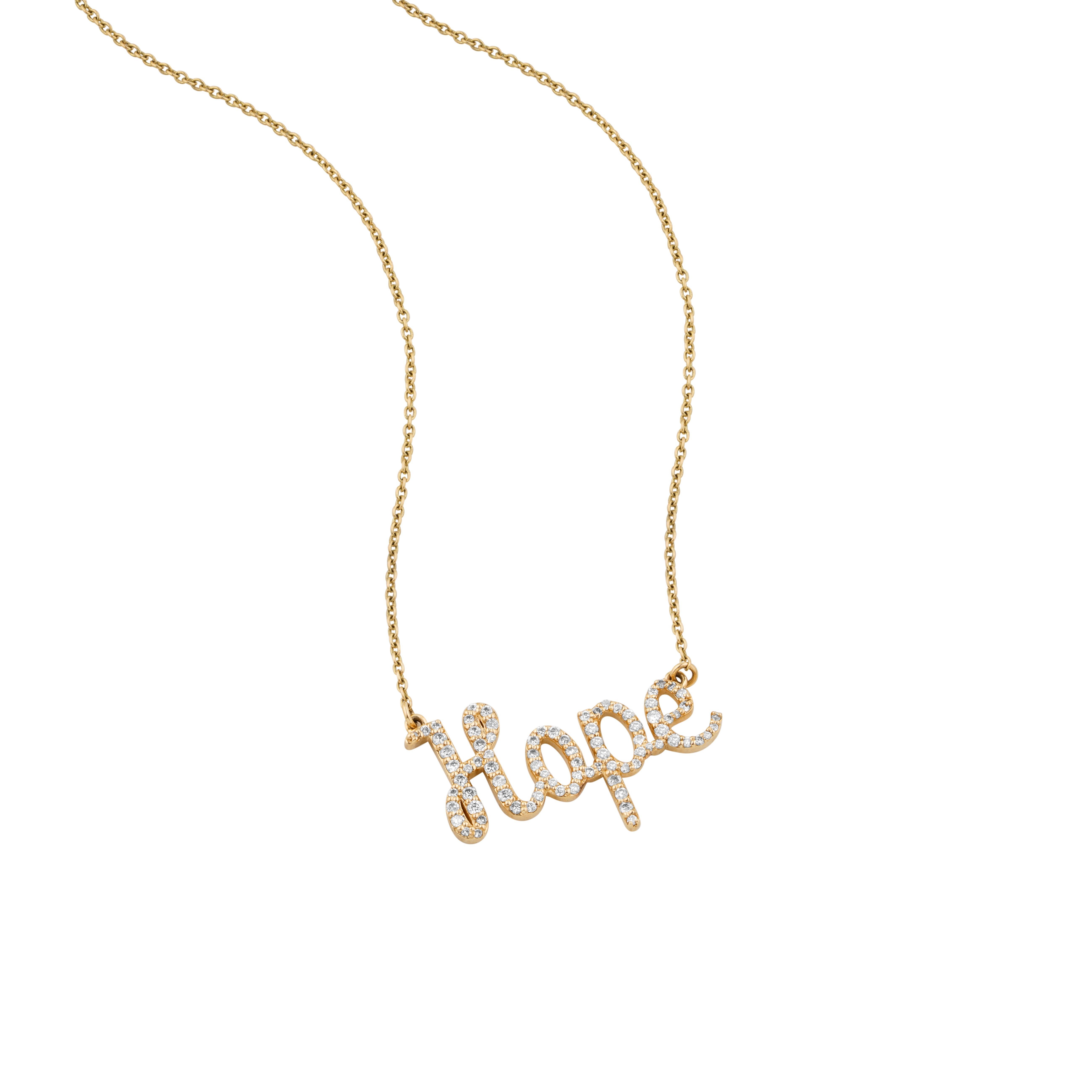 The Diamond Hope Pendant Necklace is a delicate gold pendant with the word 
