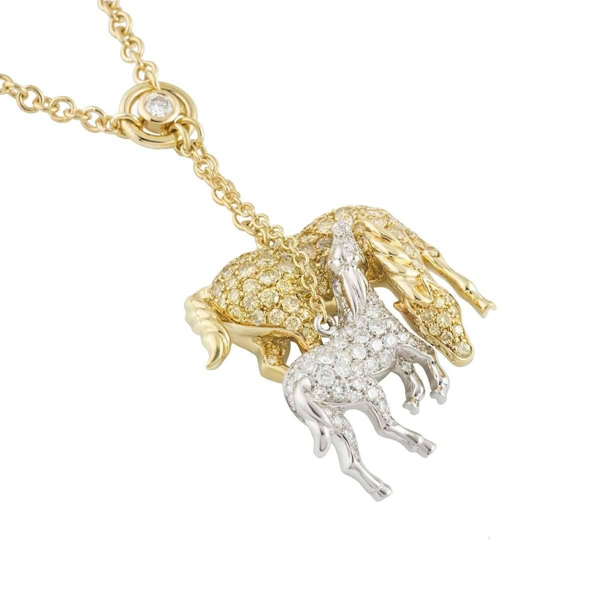 A unique large 18k yellow and white gold diamond Horse pendant. The pendant comprises of 2 Horse motifs set with round brilliant cut pave diamonds and 6 rubover set diamonds set throughout the chain. One Horse is 18k yellow gold set with round