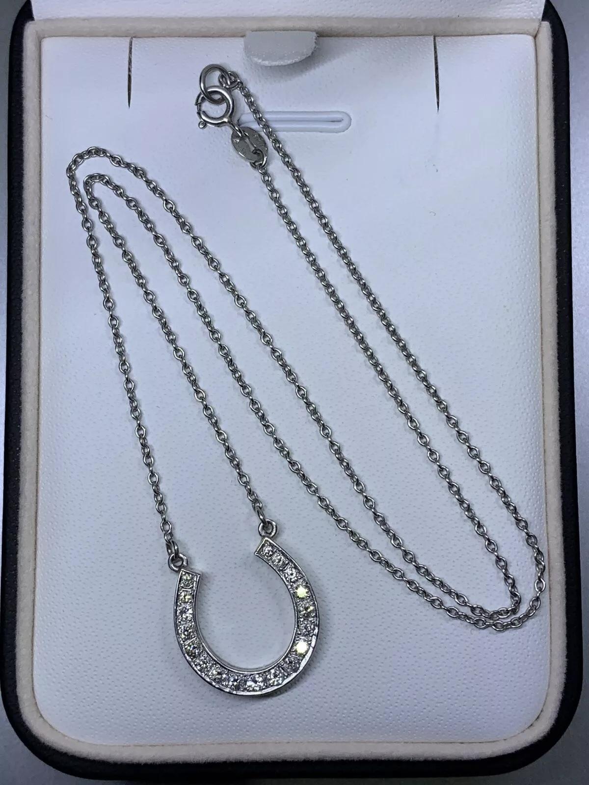 Diamond horseshoe lucky pendant necklace In Platinum 16 inches in length hallmarked.

Diamonds total weight 0.90ct G colour VS1 clarity.

Beautiful horseshoe pendant necklace in 18k white gold

Box and valuation included.

This exquisite pendant