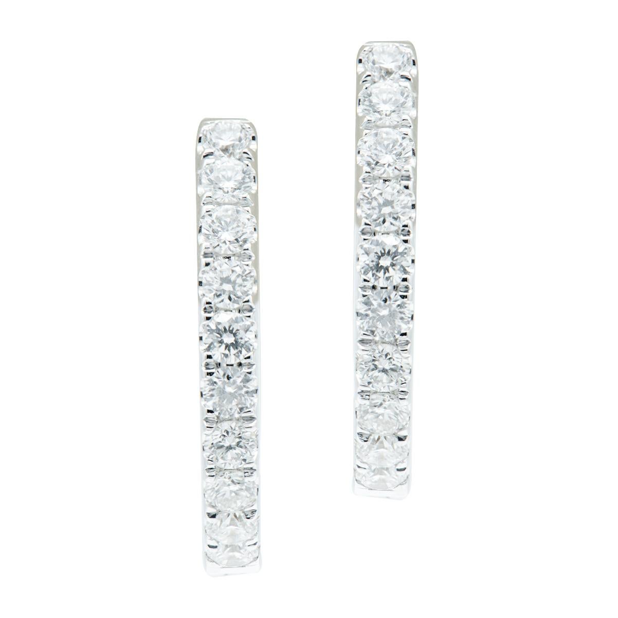 Beautiful and classic, these earrings will never go out of style and can be worn all the time or on special occasions. There are 24 round VS2, G color diamonds totaling 0.27 carats which are set in 2.9 grams of 18 karat white gold. The post securely