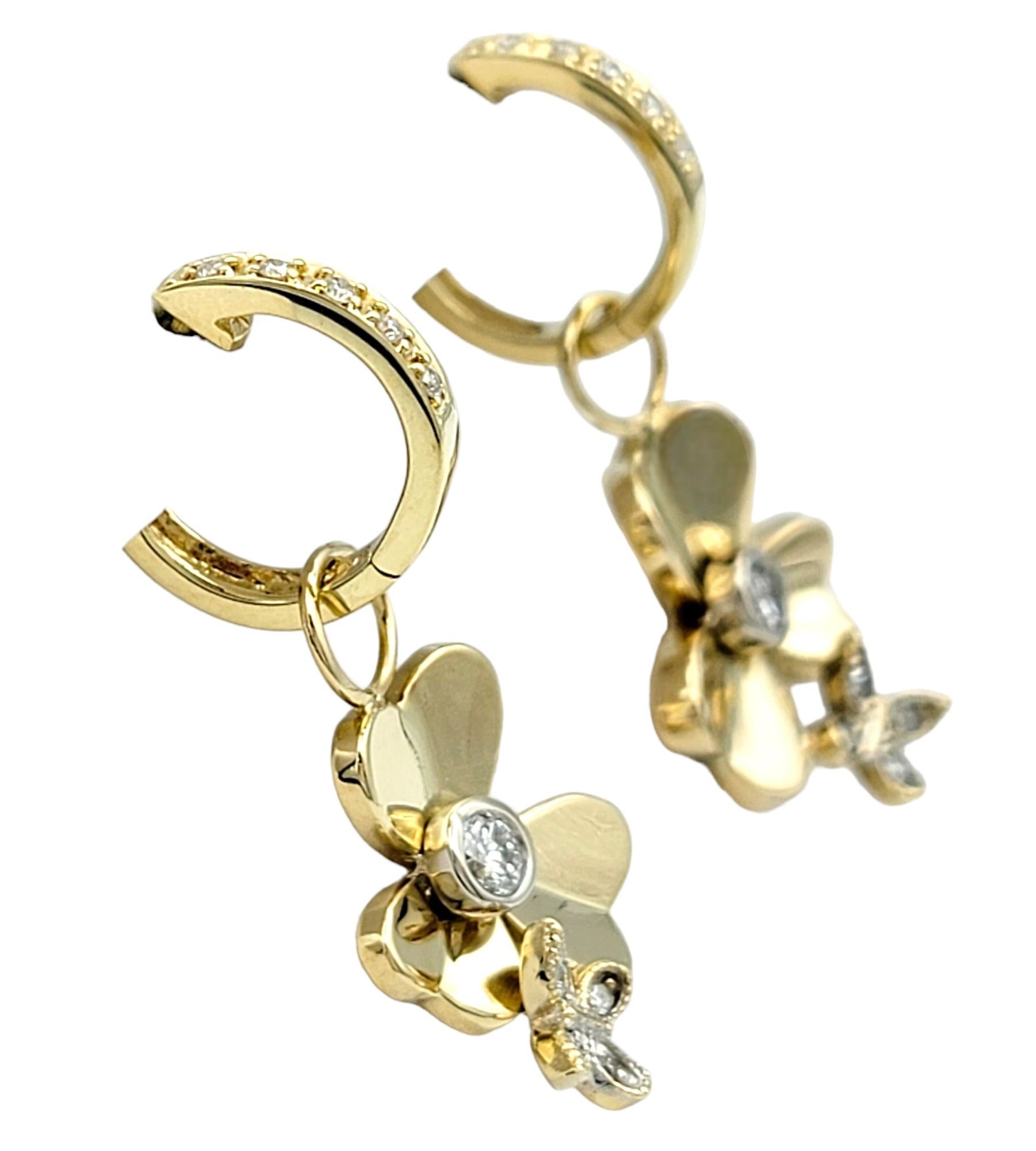 Round Cut Diamond Huggie Hoops with Flower and Butterfly Dangle in 14 Karat Yellow Gold For Sale