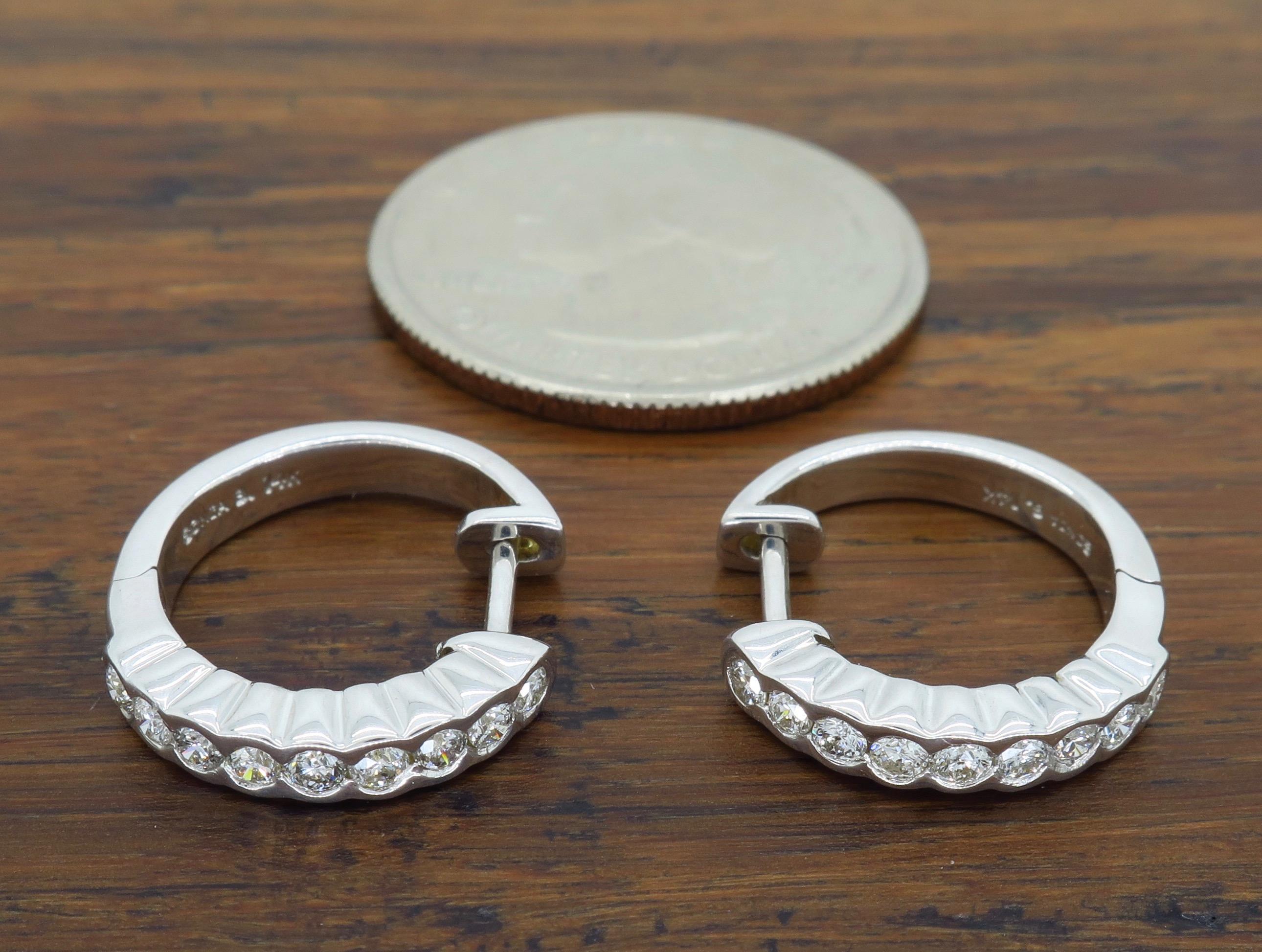 These 14K white gold hoop earrings feature approximately .50CTW of beautiful Round Brilliant Cut Diamonds.

Diamond Carat Weight: Approximately .50CTW 
Diamond Cut:  18 Round Brilliant
Color: Average G-I
Clarity: Average SI-I
Metal: 14K White