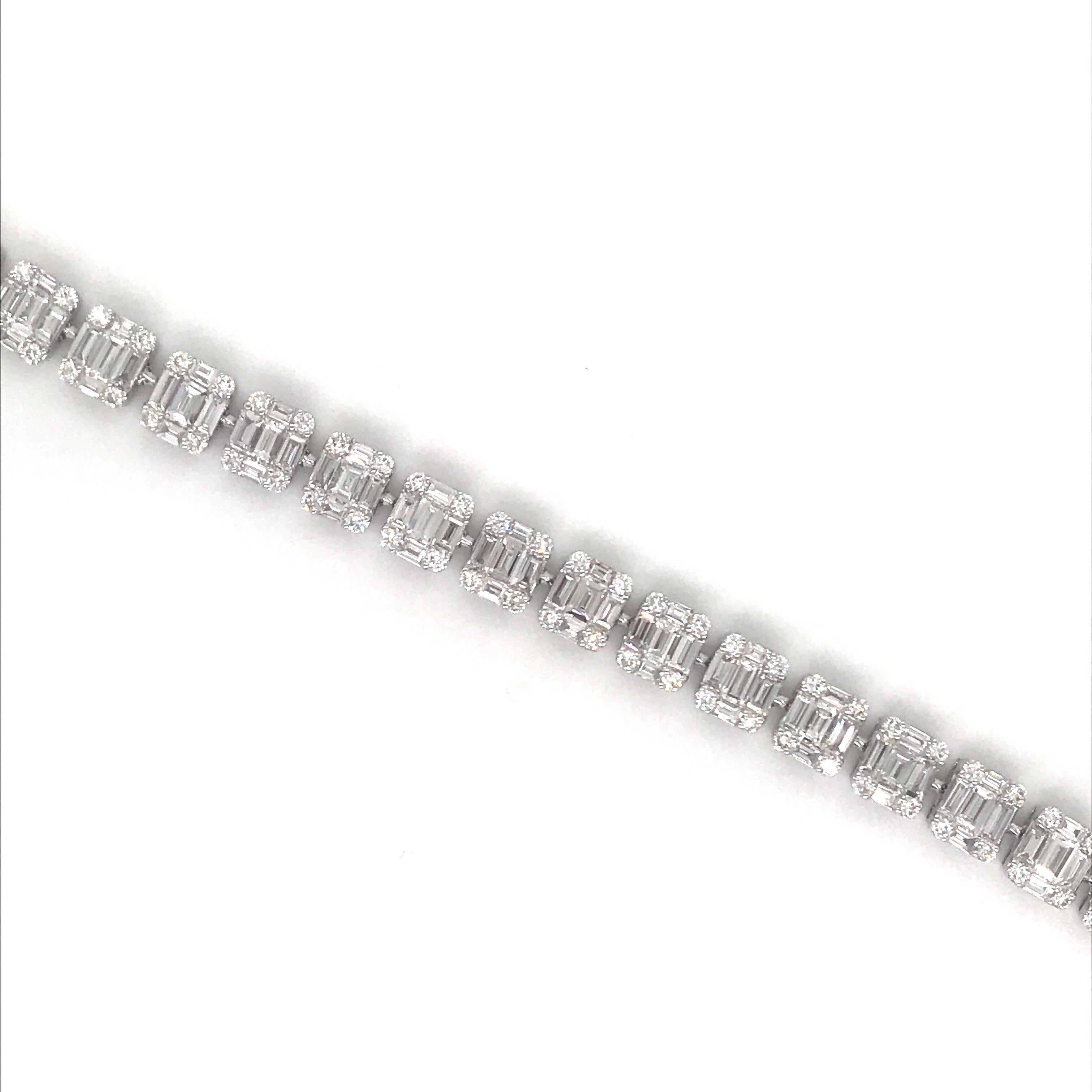 18K White gold illusion tennis bracelet featuring 135 baguette diamonds weighing 6.09 carats surrounded by 108 round brilliants weighing 1.57 carats.
Color G-H
Clarity SI