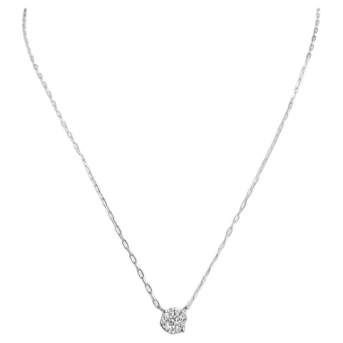 This beautiful natural diamond pendant necklace features a gorgeous arrangement of princess and marquise-shaped diamonds that create the illusion of one large diamond! The total weight of the diamonds is actually .41 carats, but the design gives the
