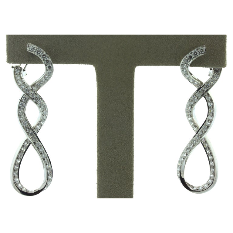 Diamond Infiniti 18k White Gold ClipOn Earrings For Sale at 1stDibs