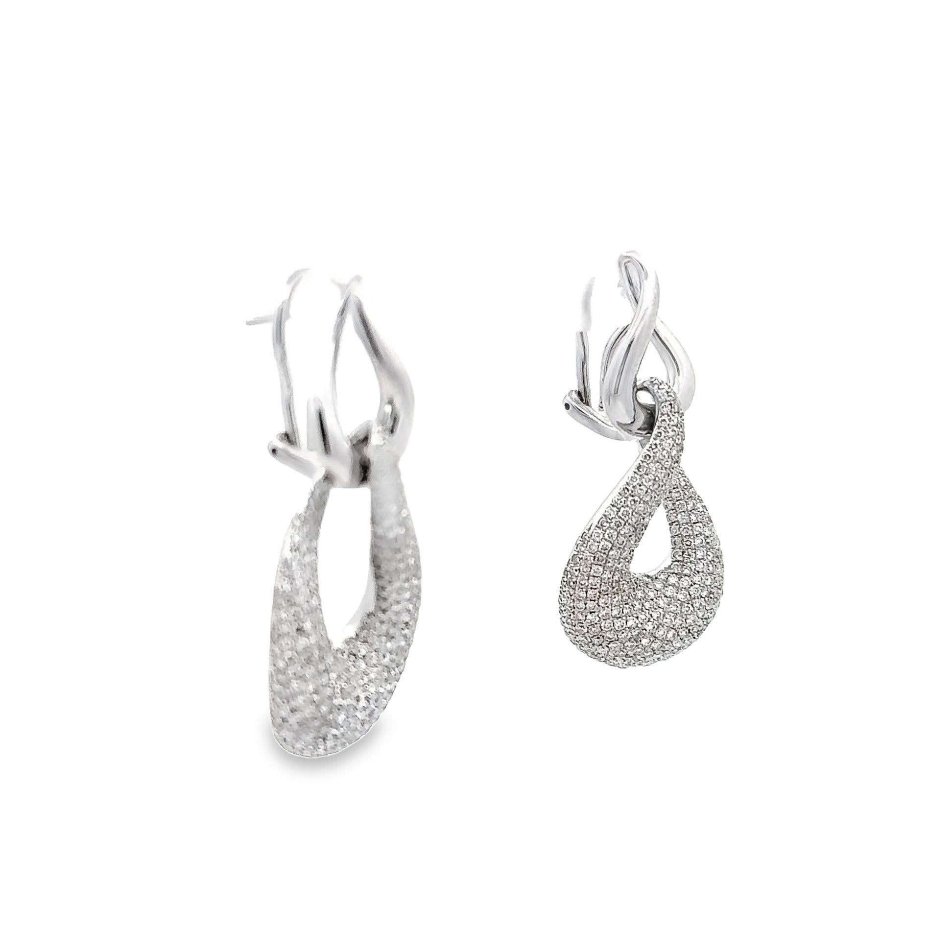 Elevate your look and make a statement with these stunning teardrop earrings with its 3.69 carats of pave-set round brilliant-cut diamonds. Crafted with a sharp sense of detail and nestled within organic shapes are sparkling teardrops, each one