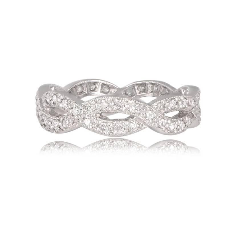 A captivating vintage-style infinity wedding band featuring exquisite milgrain detailing along its edges. The band's intricate design is complemented by pave-set diamonds, with a total width of 4.55mm. The diamonds exhibit H color and VS2 clarity,