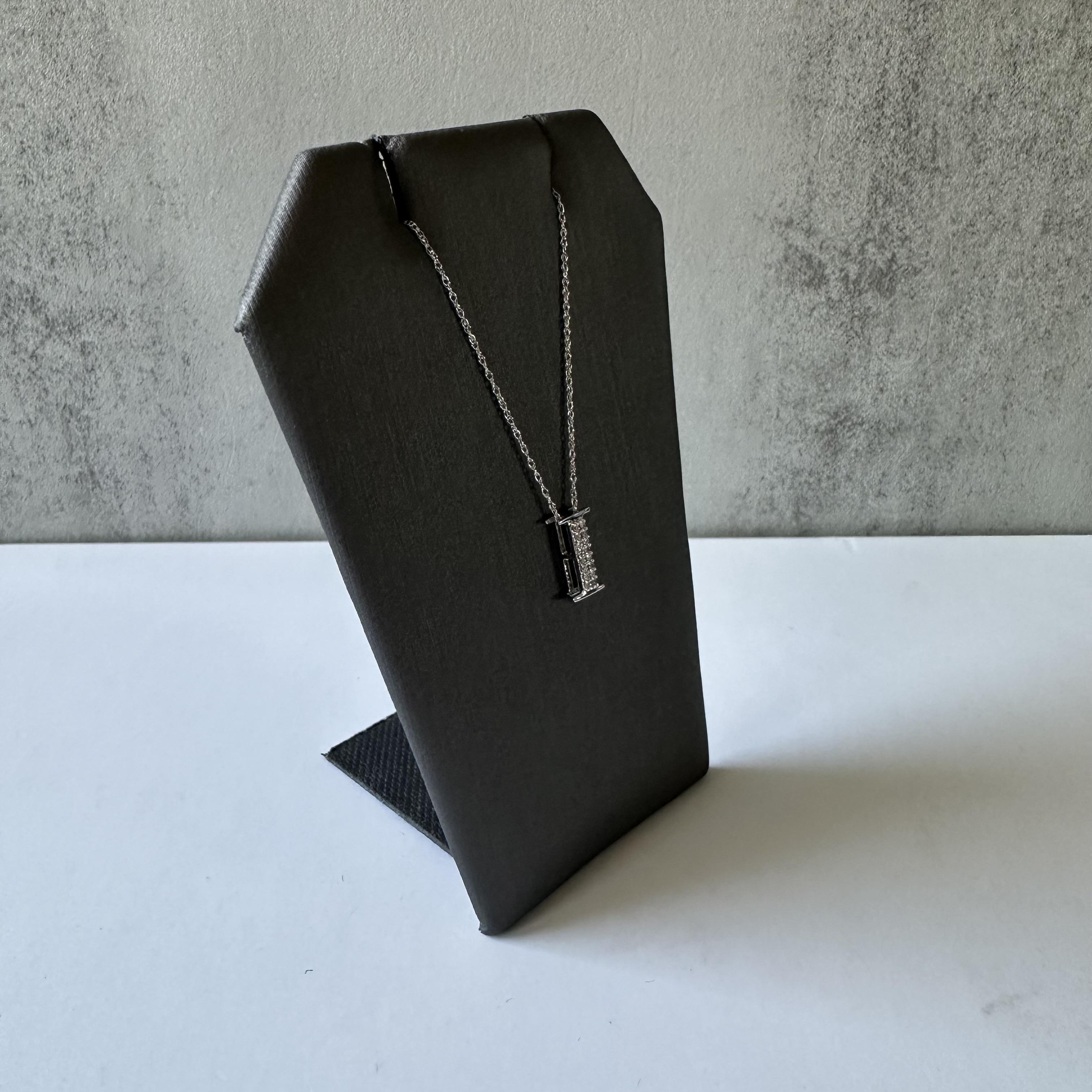 Discover the refined allure of this Diamond Pendant Necklace in 10k White Gold. Featuring a sleek design, this necklace showcases single-cut diamonds with a carat weight of 0.08, offering a subtle yet captivating sparkle. The diamonds, with an H