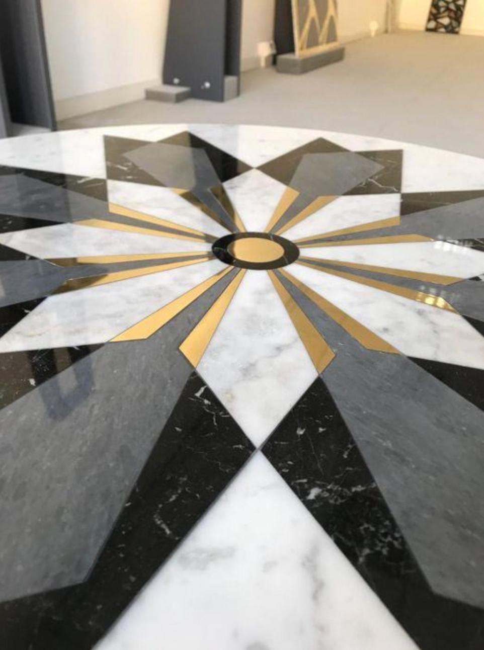 This diamond inlay table is designed by Davide Silvestri of Carrara, Italy. 

The materials used for this particular edition of 30 include white Carrara marble, Nero Marquina, grey Imperiale marble and brass inlays. Base material and dimensions can