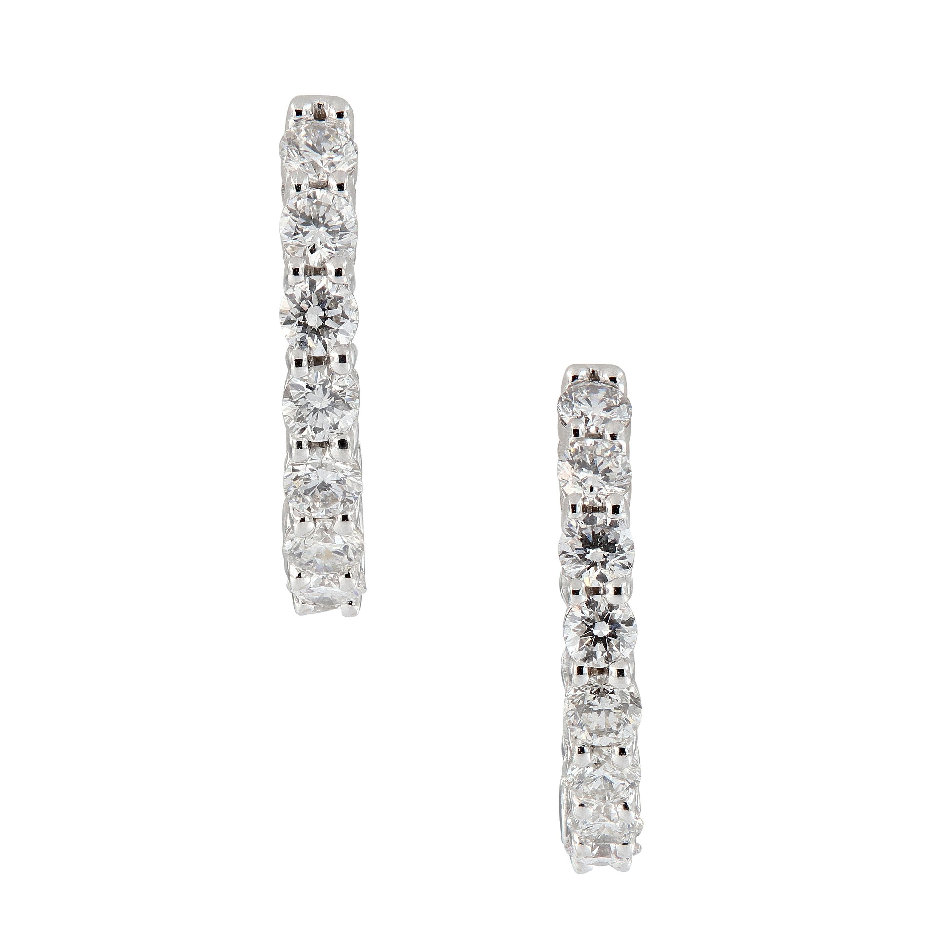 This sparkling pair of earrings features 1.50 carats of diamonds crafted in 18k white gold. Weigh 4.8 grams.

Diamonds 1.50 cttw, G-H