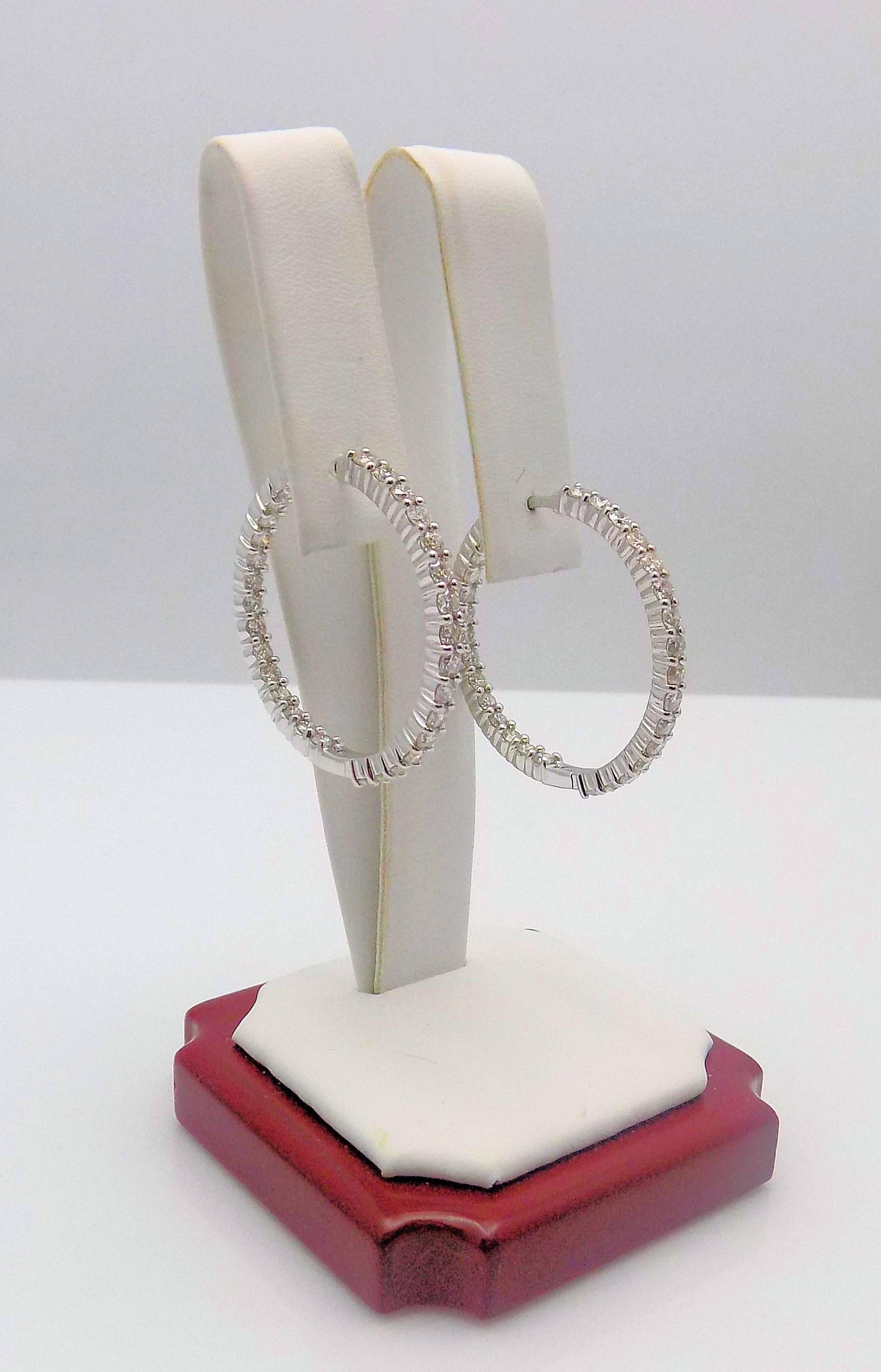 A Dazzling Pair of 18 Karat White Gold Inside-Outside Hoop Earrings 60 Round Brilliant Diamonds 3.00 Carat Total Weight; SI, H; 1.25