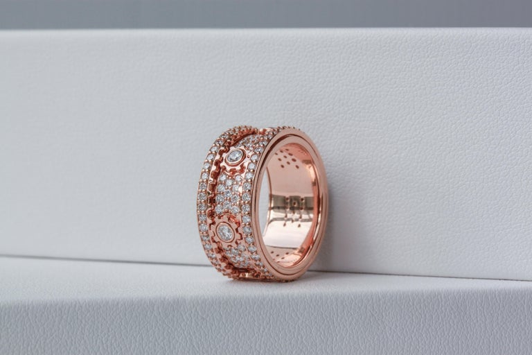 18K Rose Gold
2.16ct Natural VVS Diamonds (D-G colour)
Total ring weight 11.39g
Ring Size 55 EU / 7.25 US / 17.5mm 

While some may call it a fidget ring, this exquisite piece of jewellery is truly a work of art that is sure to capture everyone's