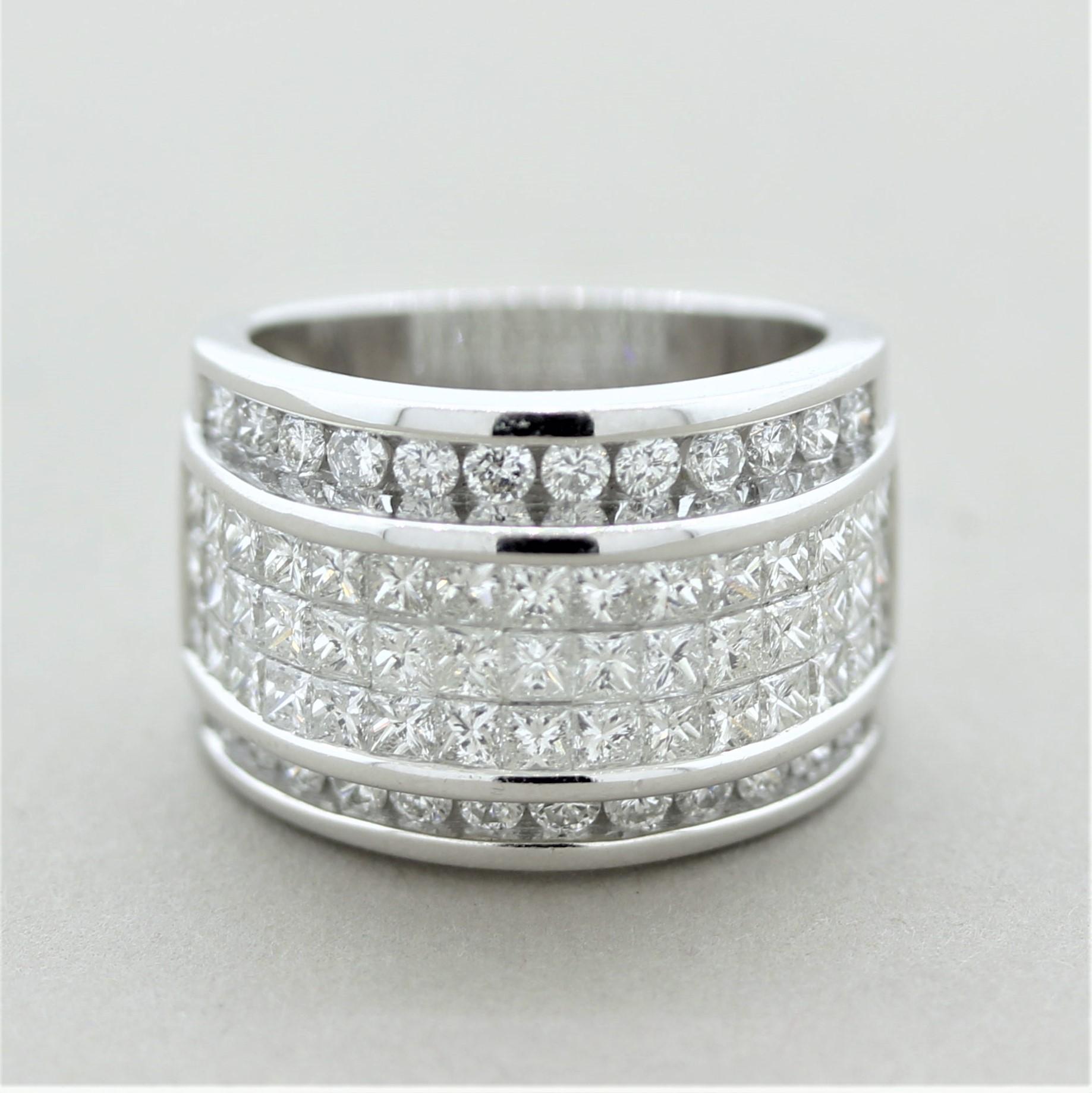 A stylish ring featuring 3.64 carats of fine diamonds. In the center of the ring are 3 rows of princess-cut diamonds which are invisible set (famous diamond setting technique by Van Cleef & Arpels). On the outsides of the ring are two rows of round