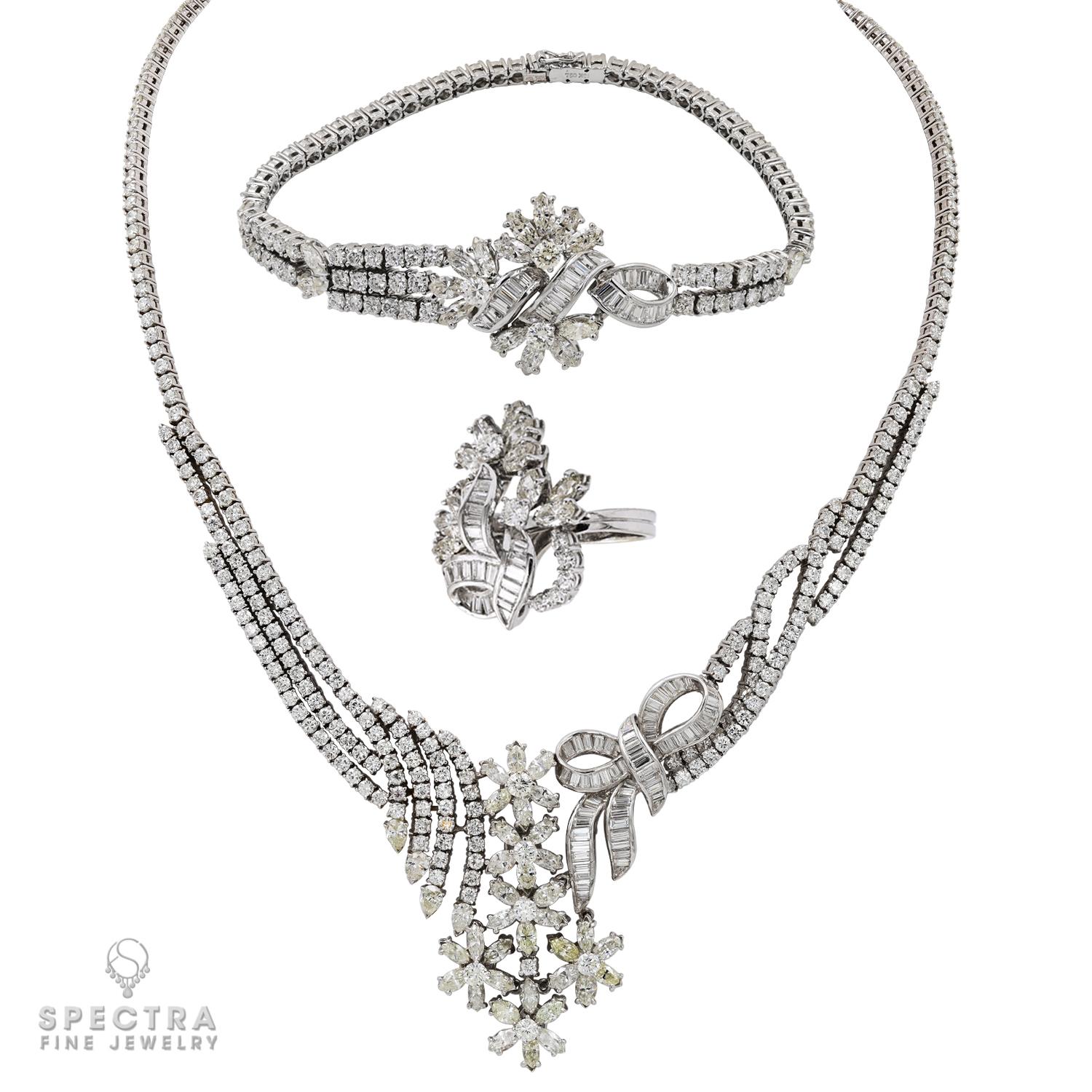 Introducing our exquisite 18k White Gold Diamond Suite, a stunning collection that exudes elegance and sophistication. This luxurious suite consists of a necklace, bracelet, and ring, each meticulously crafted with the finest materials and adorned