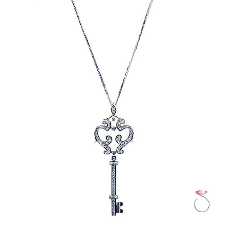 Gorgeous diamond key pendant in 18k white gold by Pippo Perez. This stunning fancy key pendant features 0.72 ct. round brilliant cut diamonds bead set on the elaborate key design. The diamond color is G & clarity is VS. The pendant is fitted on a