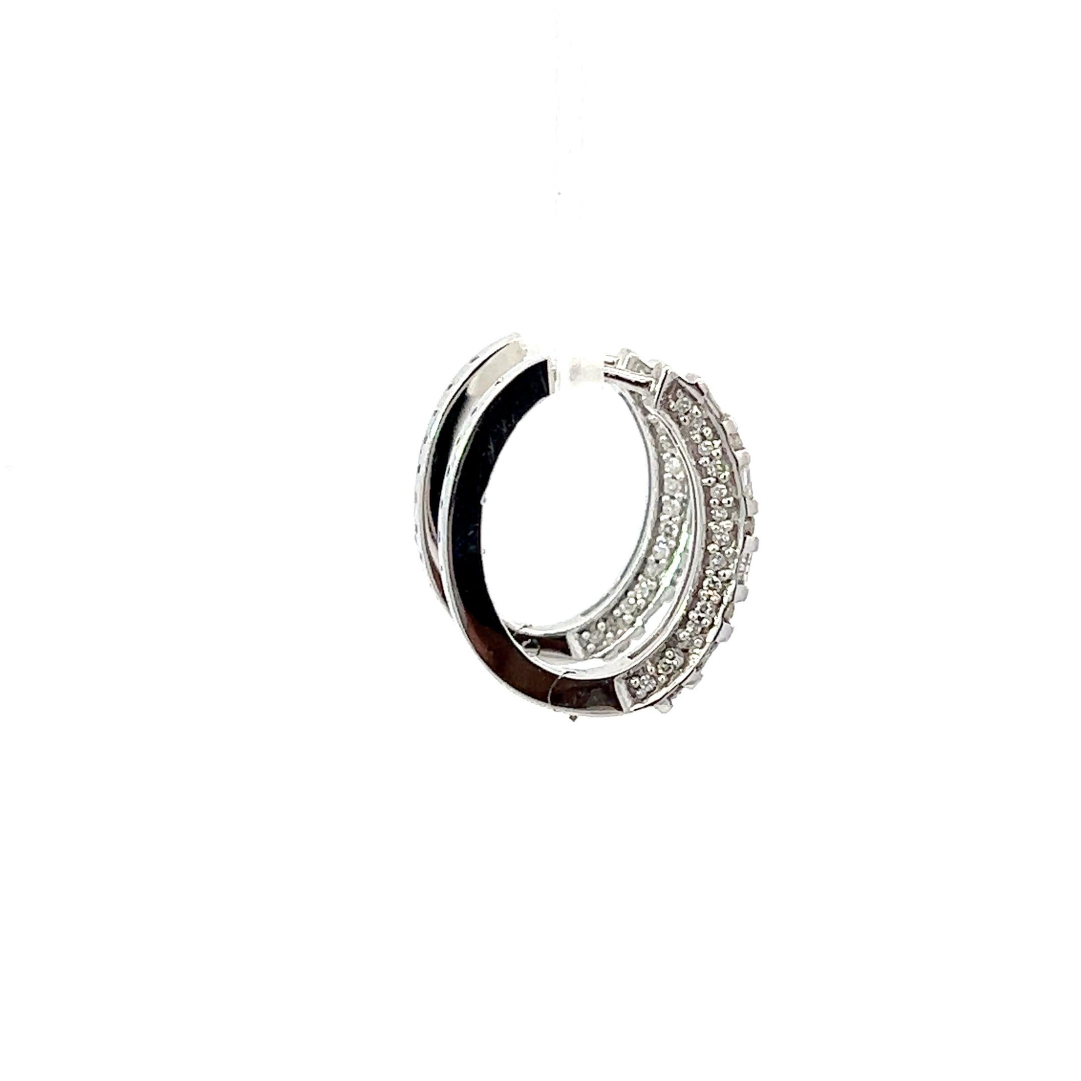 These mini hoop earrings are perfect for everyday wear with their diamond design and 14KW setting. The combination of round and emerald cut diamonds adds a touch of elegance, and the total diamond weight of 1.0CT makes them a stunning addition to
