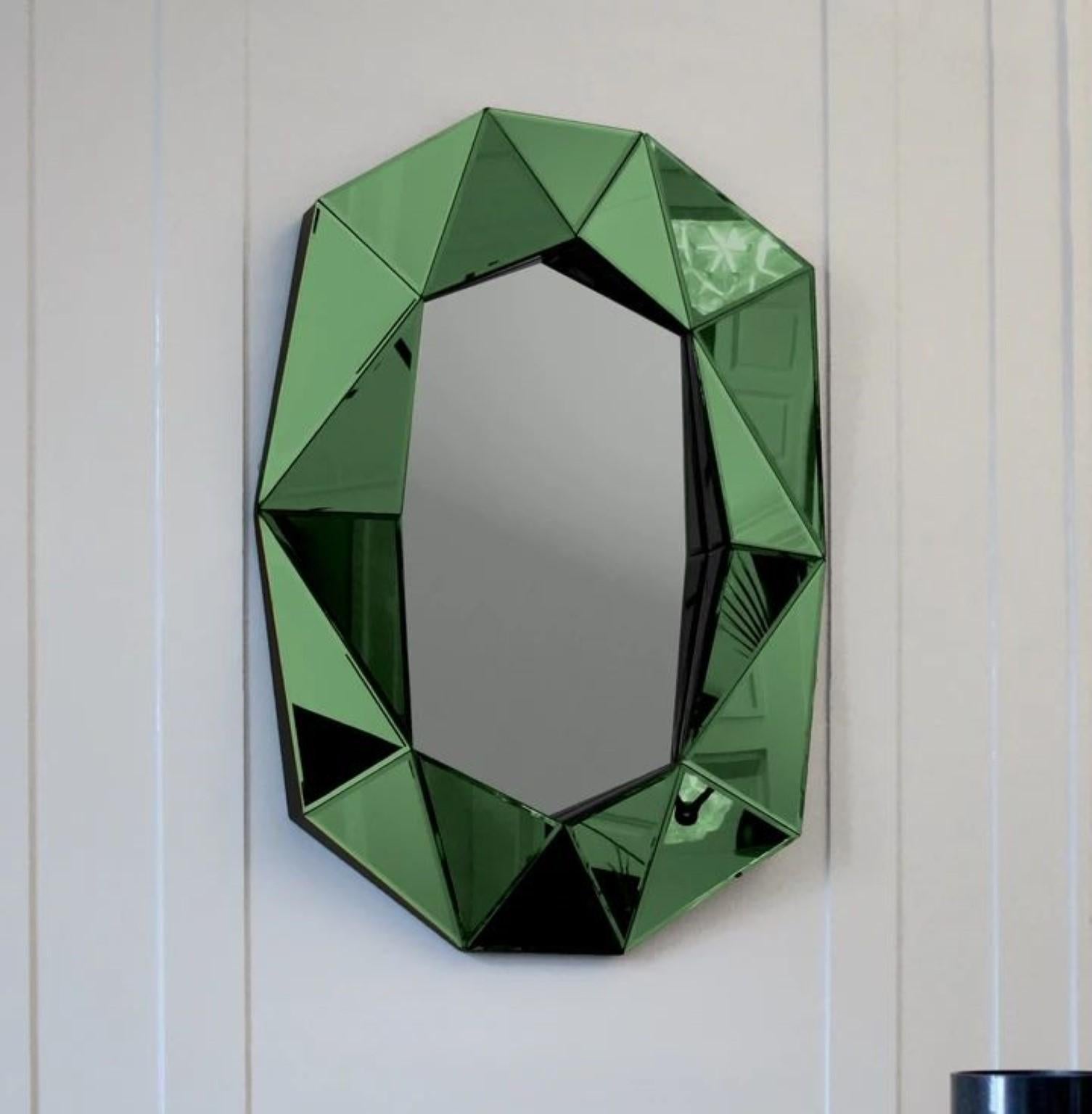 Diamond large mirror emerald
Dimensions: W 72 x D 6.2 x H 100 cm
Material: 4 mm faceted mirror on black painted MDF
Weight: 12.8 kg

The Diamond large mirror illustrates a perfect combination of function and art. This unique mirror is inspired