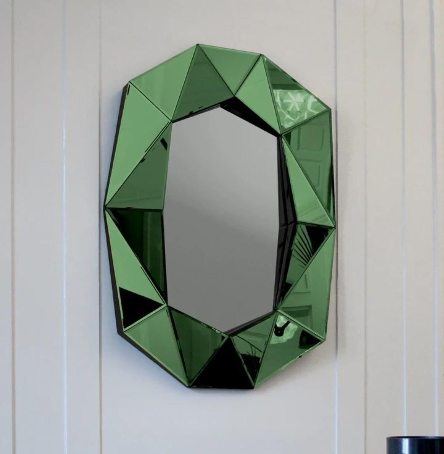 Diamond large mirror emerald
Dimensions: W 72 x D 6.2 x H 100 cm
Material: 4 mm faceted mirror on black painted MDF
Weight: 12.8 kg

The Diamond large mirror illustrates a perfect combination of function and art. This unique mirror is inspired by