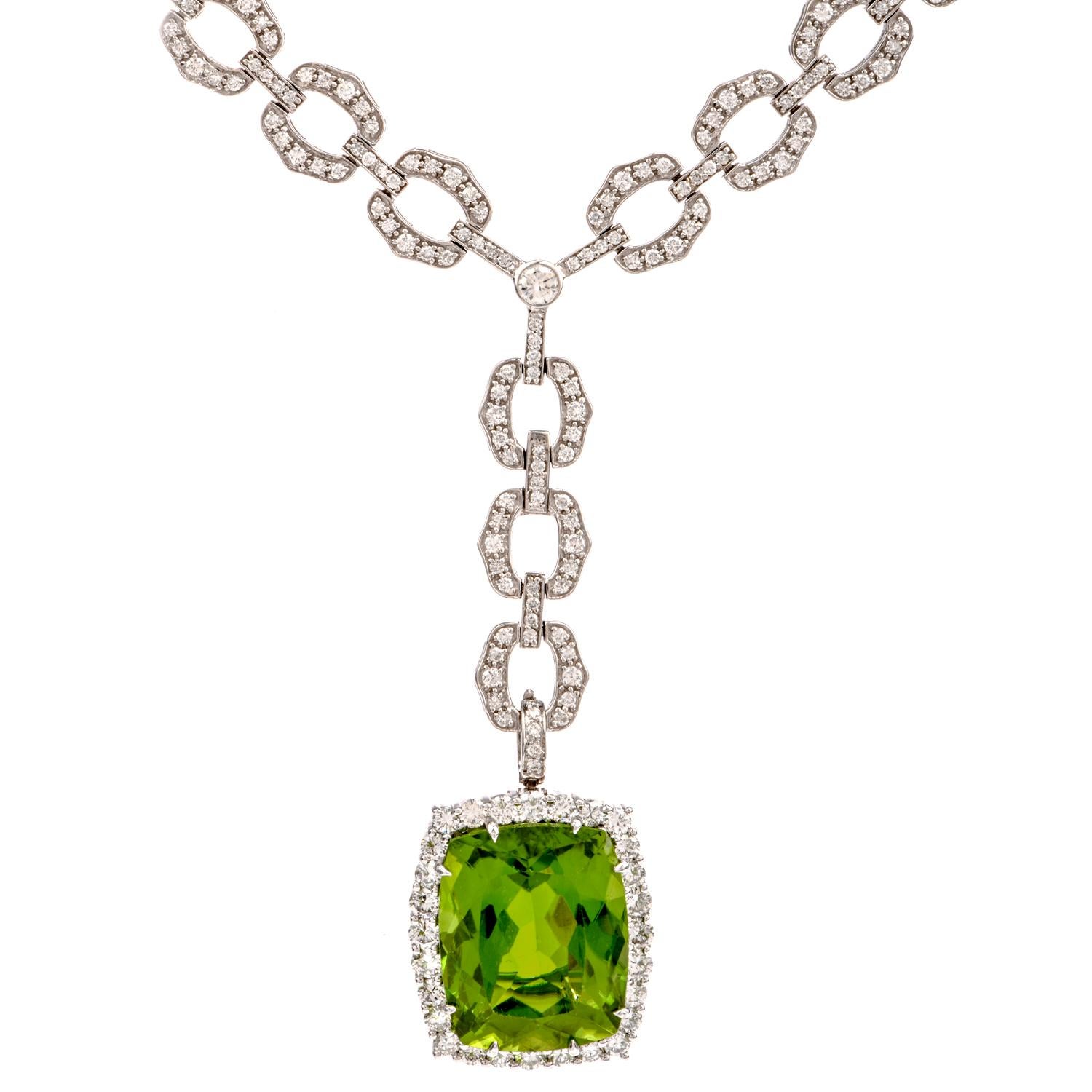 This eye catching Diamond and Peridot Pendant was crafted

in 18K white gold. 

With diamond covered links throughout, the detachable pendant 

enhancer features a Large Rectangular shaped Green Peridot, weighing approx. 33 carats dangling from the