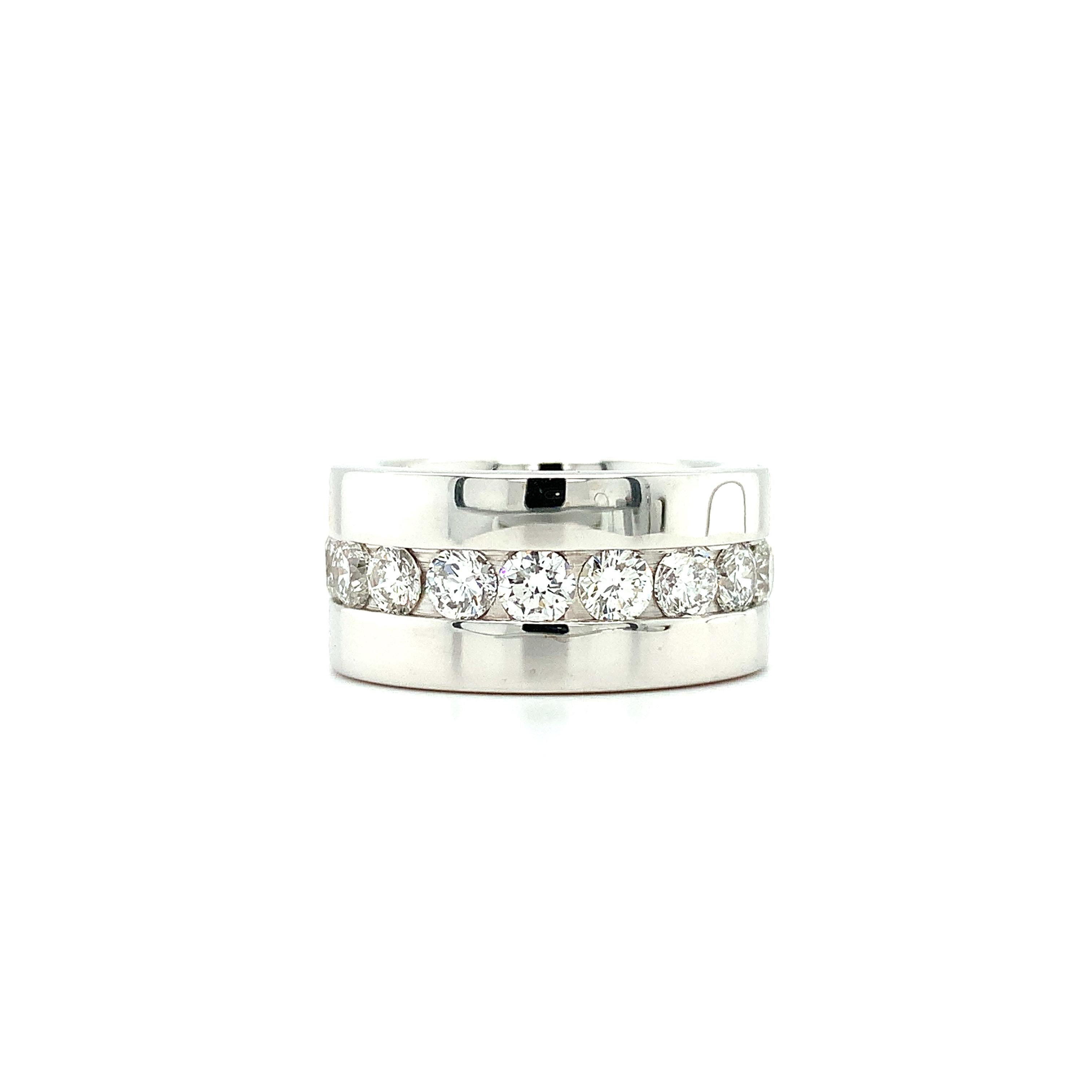 Large and wide full eternity diamond ring in 18ct white gold.
Composed of round brilliant cut diamonds all way around the band securely set full eternity large wedding band mounted in 18ct white gold.
Round brilliant diamonds total weighing 3.60ct F