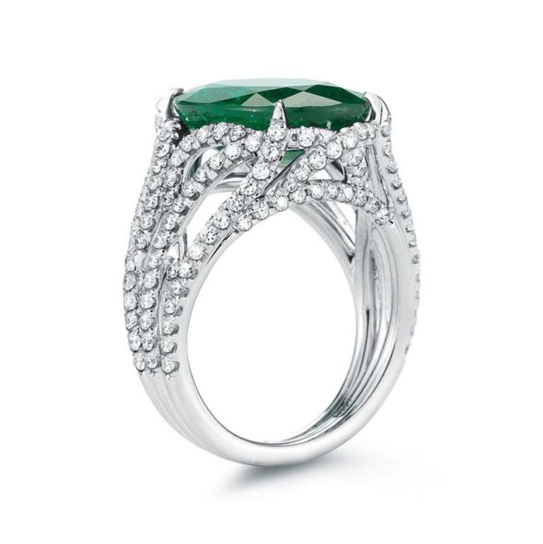 DIAMOND LATTICE EMERALD RING Diamond vines swirl around a beautiful oval cut emerald for a dramatic look. Item: # 02311 Metal: 18k W Lab: Gia Color Weight: 8.48 ct. Diamond Weight: 1.62 ct.
