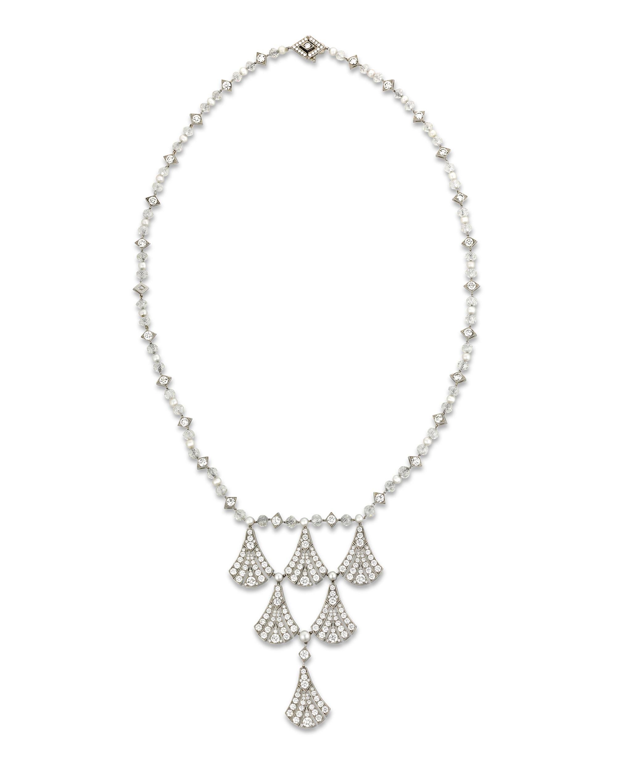 Six diamond-encrusted fans are suspended from a pearl and diamond bead chain in this elegant lavalier necklace from Tiffany & Co. Round diamonds totaling 11.59 carats make up the fan shapes while faceted diamond beads and round diamonds totaling