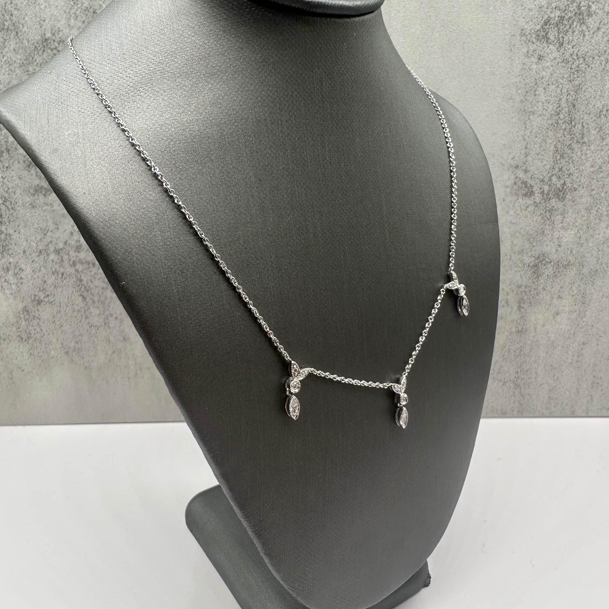 This elegant Diamond Layering Necklace in 14kt white gold features 0.50ctw of natural GH SI round and marquise cut diamonds, offering a stunning sparkle. At 16.5 inches in length, it is perfect for layering or wearing alone for a sophisticated look.