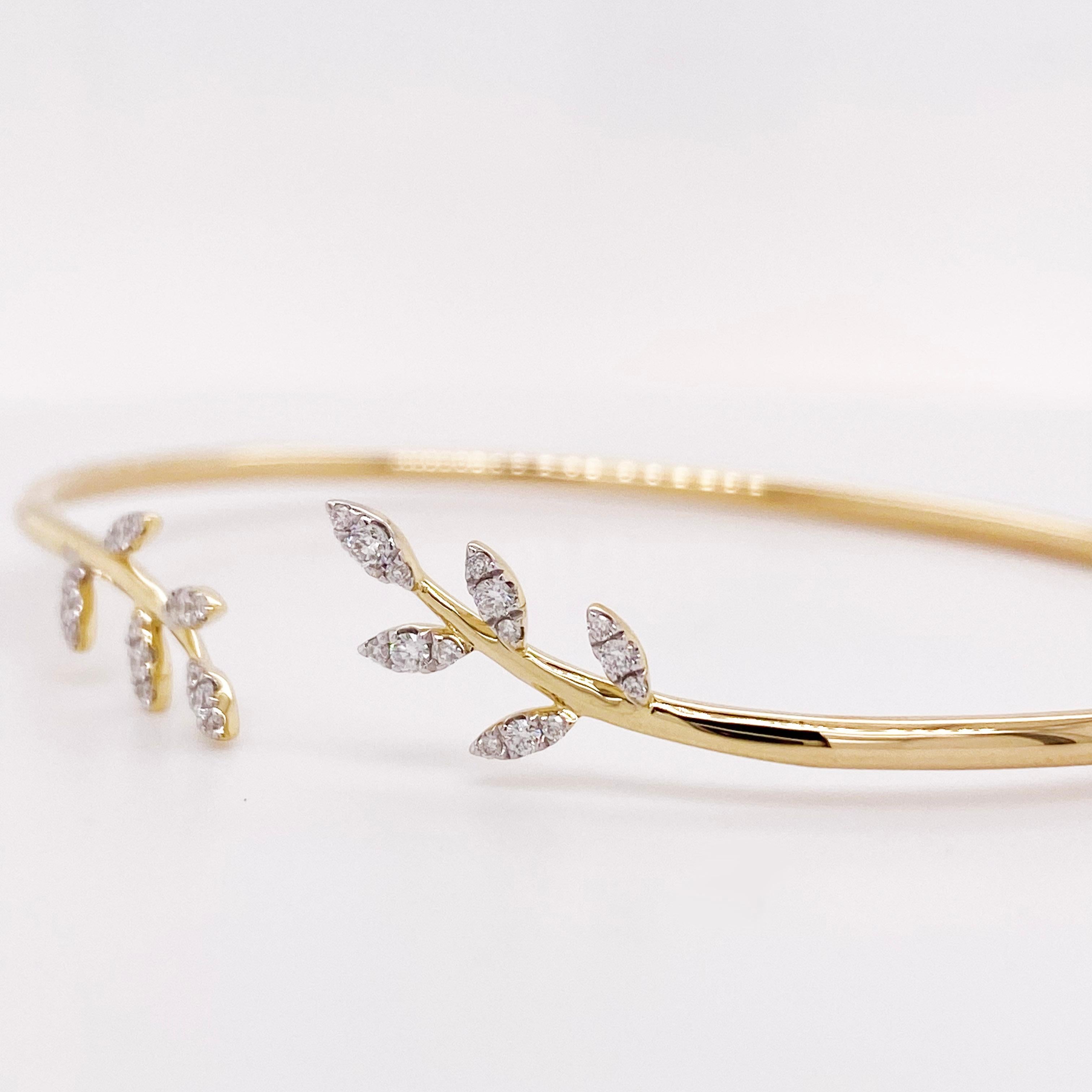 This organic leaf designed bracelet has a diamond on each leaf! The bracelet is flexible and fits most wrists. It is so easy to put on-no clasps or catches to mess with. You just push one side up and the other down and your wrist slides into it