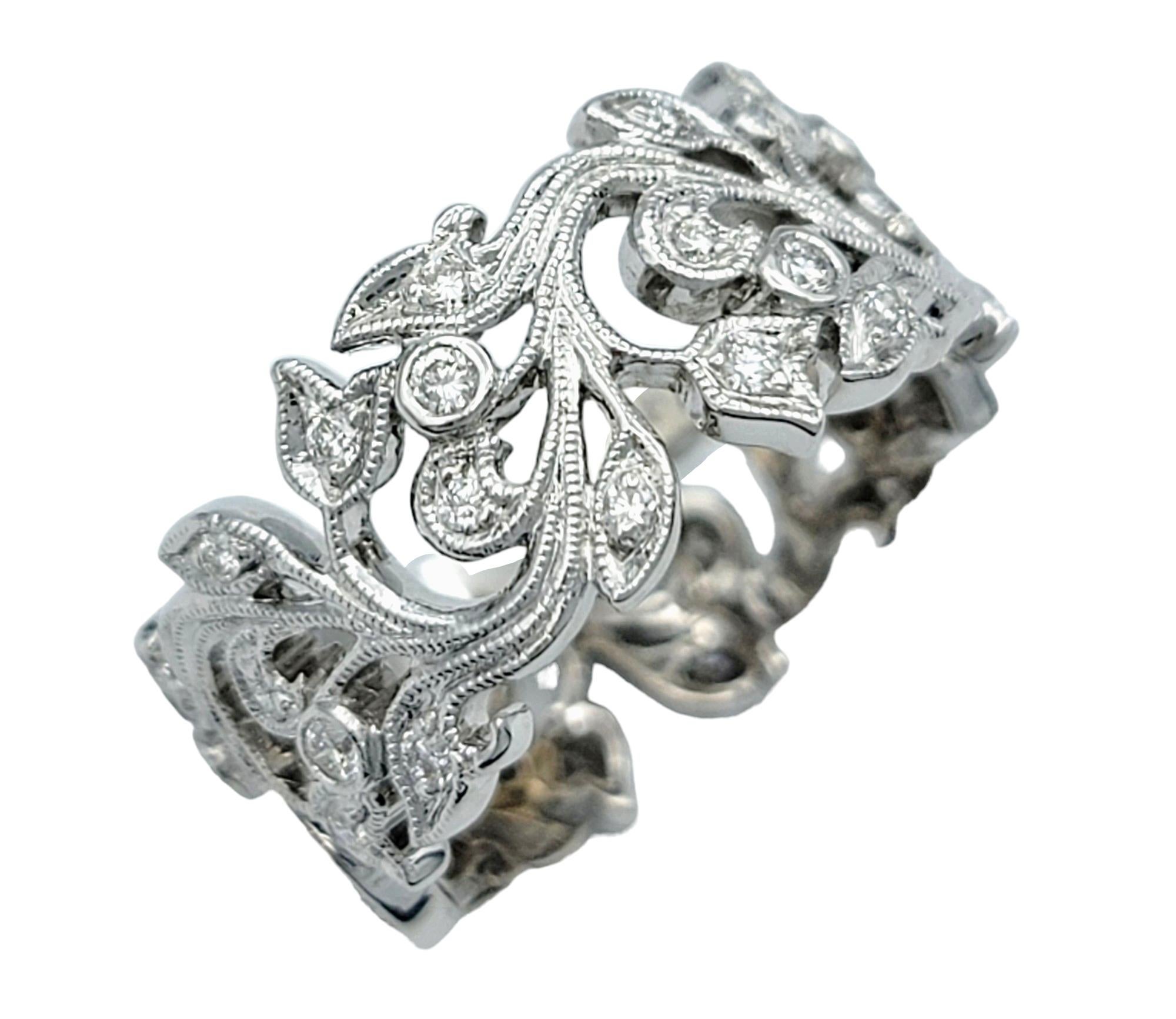 Ring Size: 5.75

This beautiful cut out leaf motif band ring is exquisitely crafted with diamonds and a milgrain design. This elegant ring features intricate leaf-shaped cutouts, beautifully accented with sparkling diamonds that add a touch of