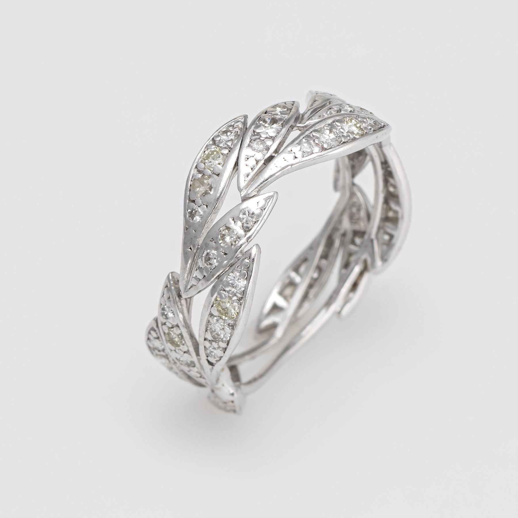 Finely detailed vintage diamond eternity ring, crafted in 900 platinum. 

A total of 49 round brilliant cut diamonds total an estimated 0.55 carats (estimated at J-K color and SI1-I1 clarity). 

The stylized leaf band gracefully hugs the finger. It