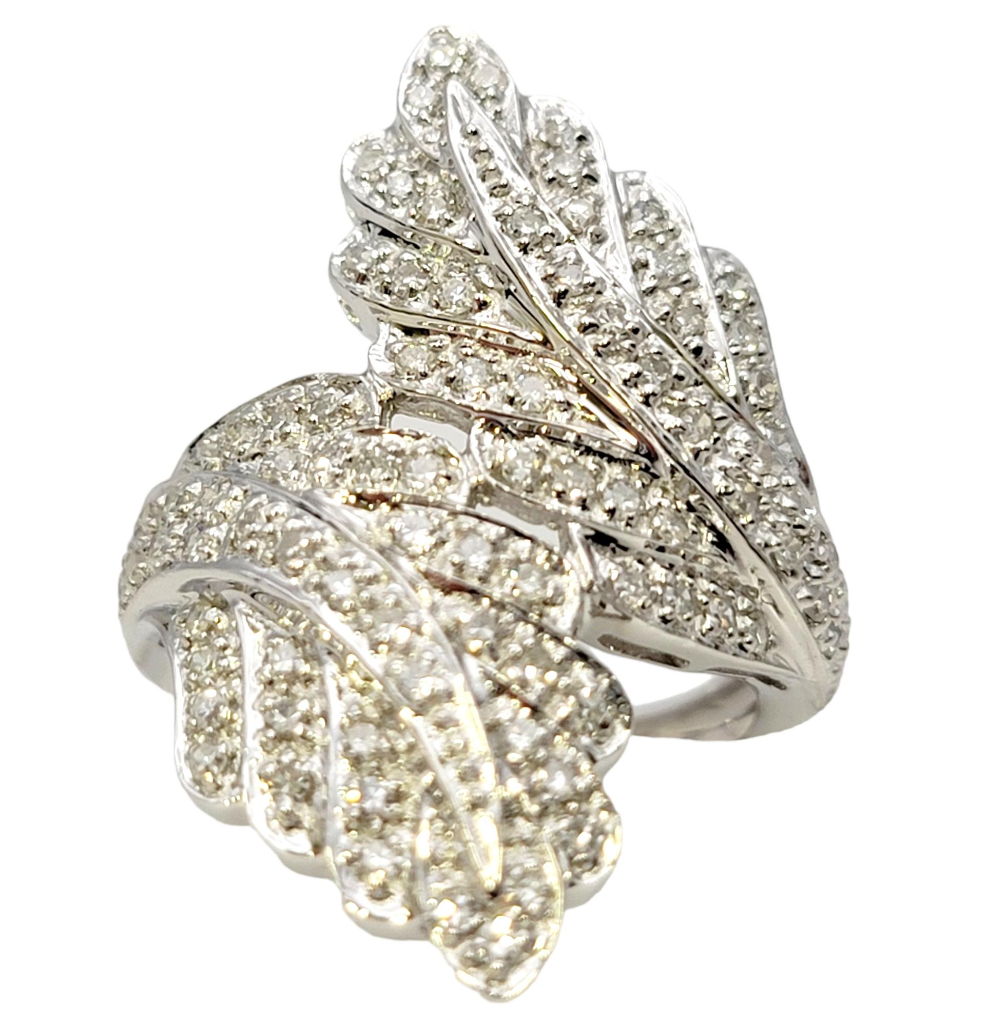 Ring size: 6

This spectacularly sparkly diamond bypass ring makes a stunning statement on the finger. Beautifully textured and glittering, this substantial ring will not go unnoticed.  

This superb cocktail ring offers the perfect balance of