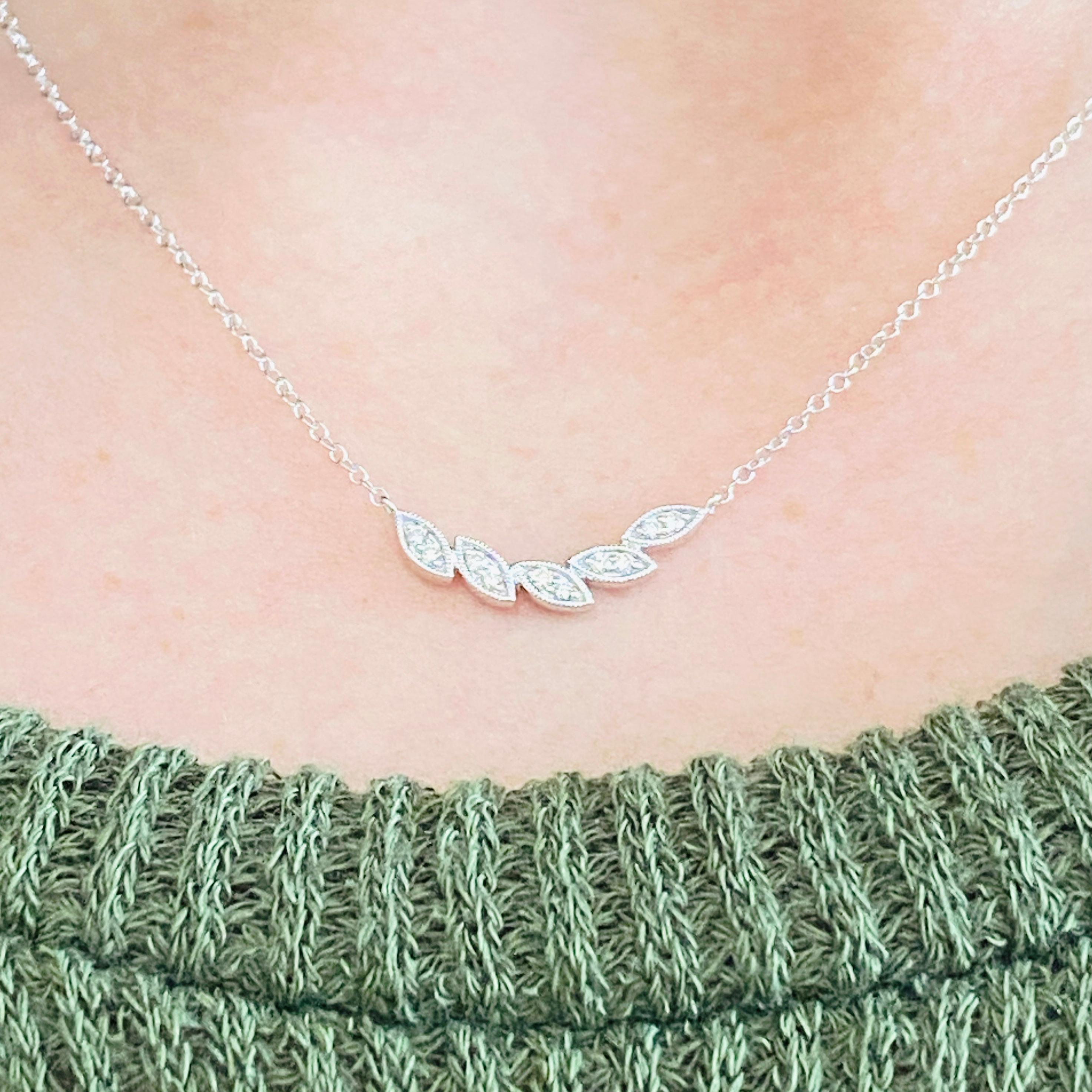 This gorgeous 14k white gold leaf curved bar necklace dripping with diamonds is the perfect mix between classic and trendy! This necklace is very fashionable and can add a touch of style to any outfit, yet it is also classy enough to pair easily