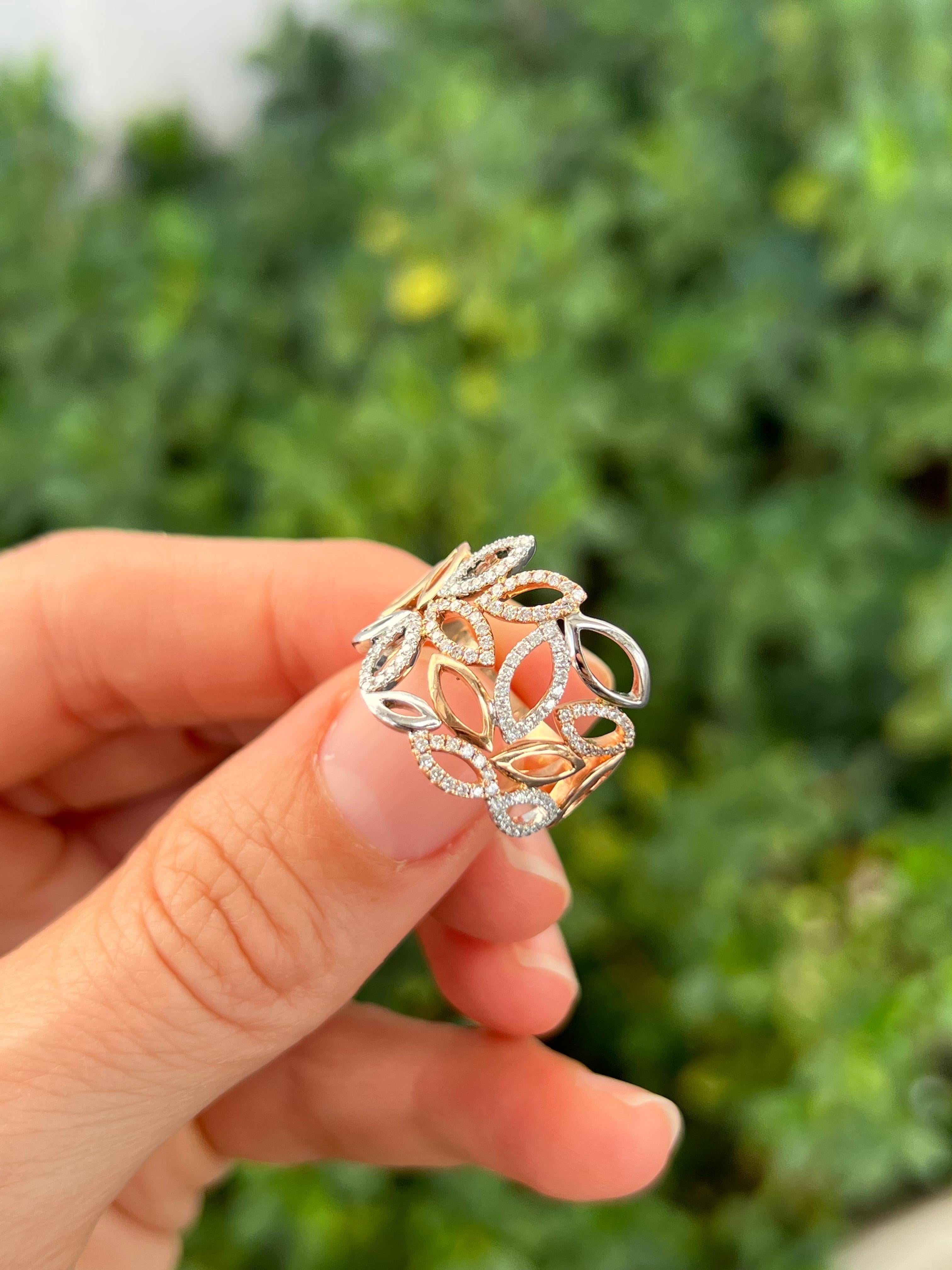 Modern lines leaf ring in rose gold with diamonds set on white gold. 

Features
14k rose gold and white gold.
.46 carat diamond total weight
Ring size 6.5
Can be sized.