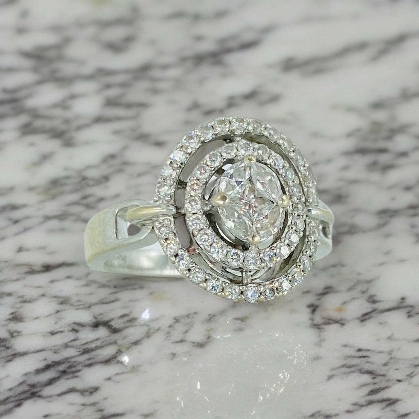 Diamond Line 0.71 Carat Diamond Double Halo Ring 18k White Gold. Extremely well-made with illusion stone settings that feature a center princess cut diamond surrounded by Marquise diamonds  cut diamonds and surrounded by double halo with round