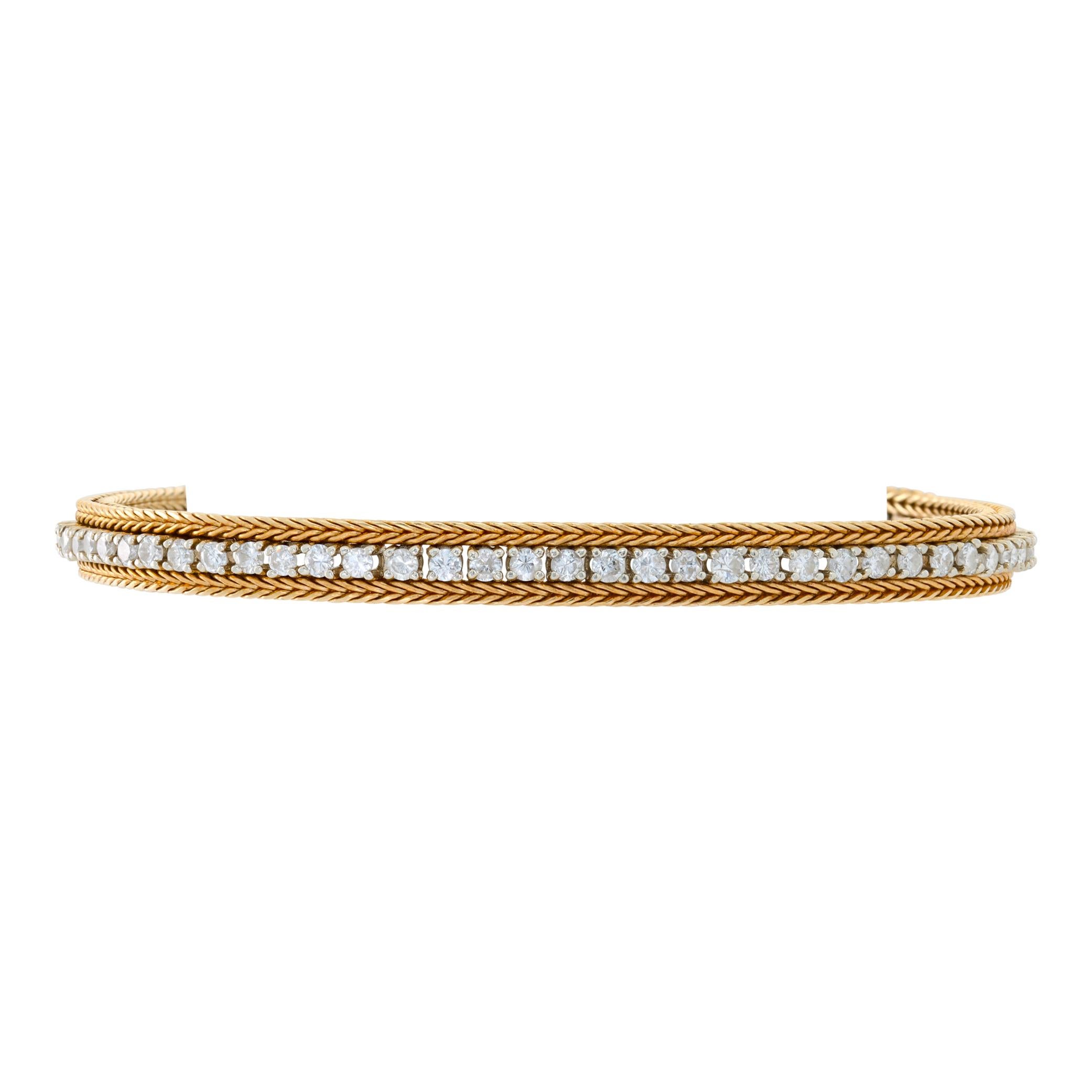 Diamond line bracelet in 14k white & yellow gold with approximately 2.10 carats in round diamonds. Measures 6mm, 7.25 inch length.
