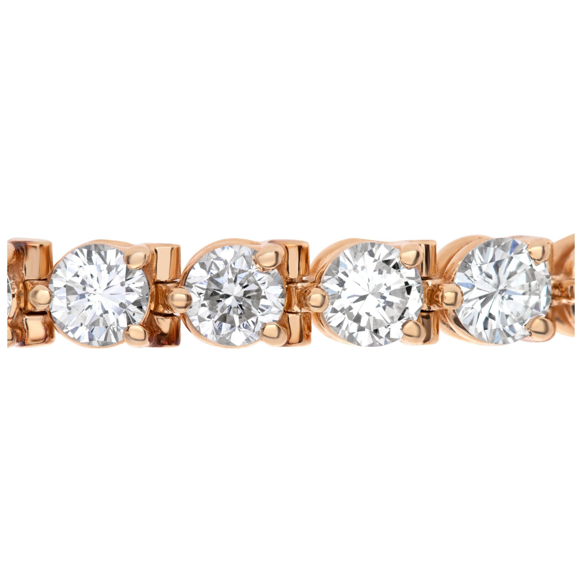Sparkling diamond line bracelet in 14k yellow gold with approximately 10 carats in diamonds H-I color, SI clarity. 7 inch length.