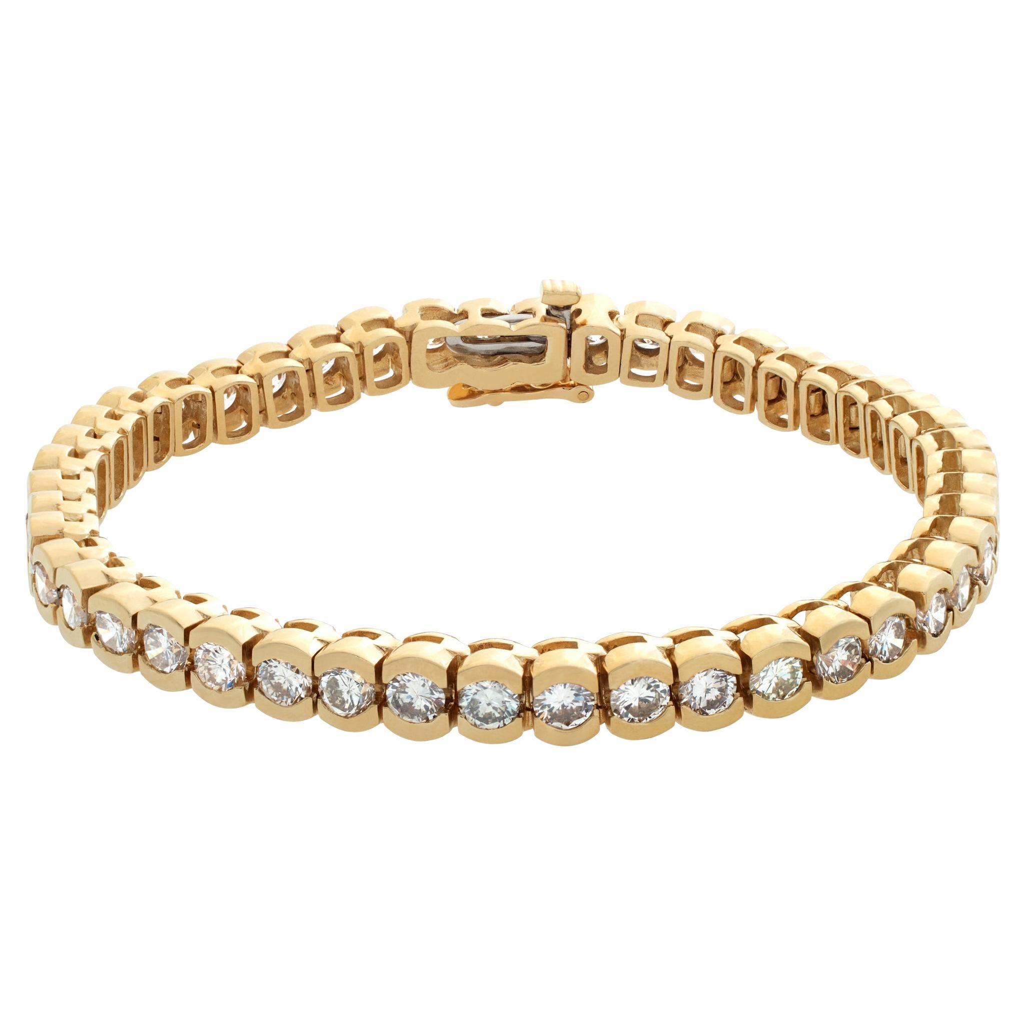 Diamond line bracelet in 14k yellow gold with over 7 carats in round diamonds For Sale