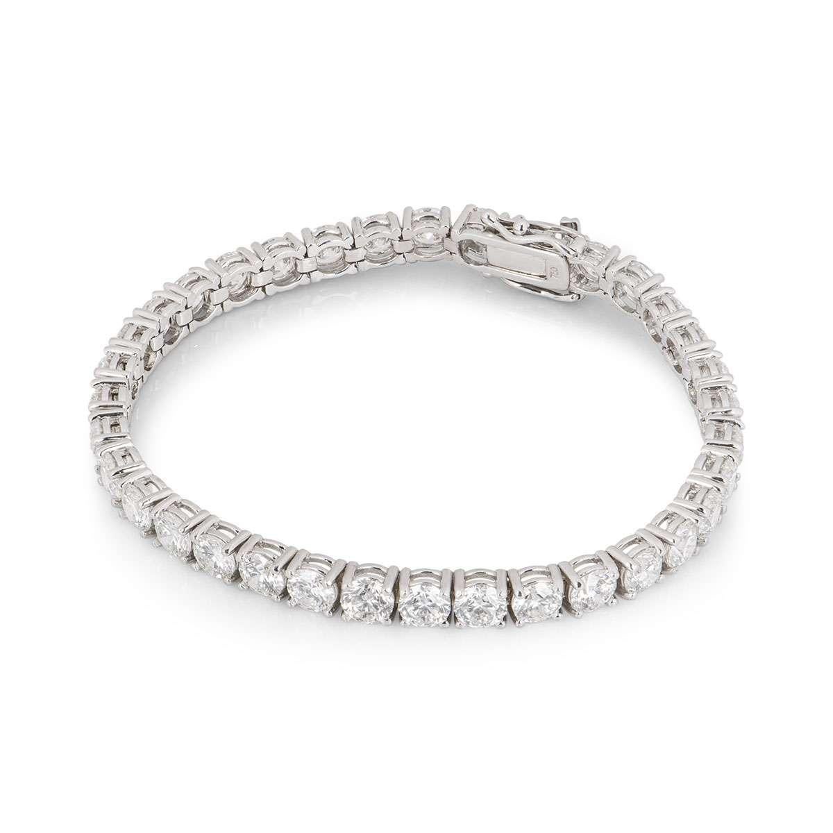 An elegant 18k white gold diamond line bracelet. The bracelet is composed of 35 claw set round brilliant cut diamonds totalling approximately 10.50ct. The diamonds are predominantly F-G colour and VS+ clarity. The bracelet measures 6.5 inches in