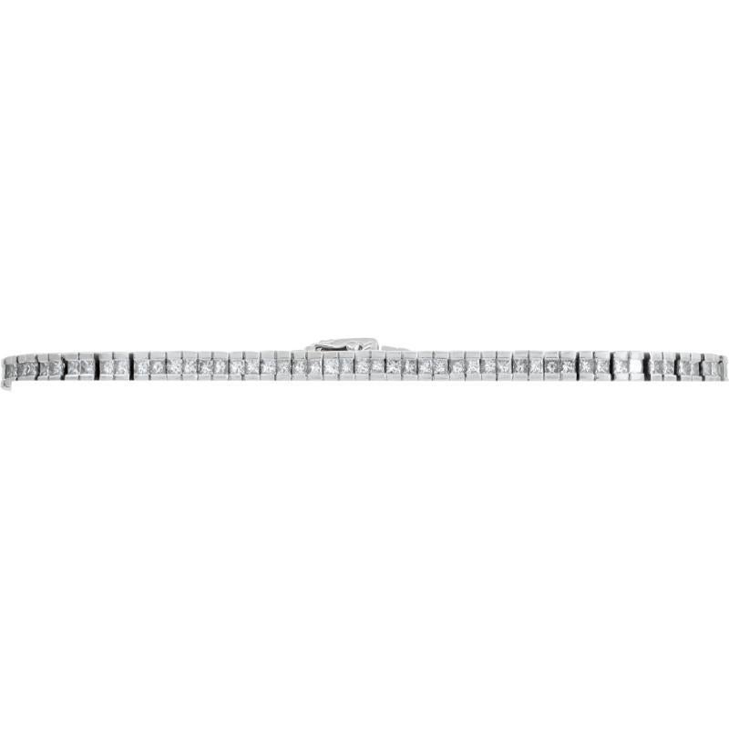 Diamond line bracelet in 18k white gold with approximately 3.18 carats in princess cut diamonds (G-H color, SI clarity). 7 inch length. 3.3mm width.