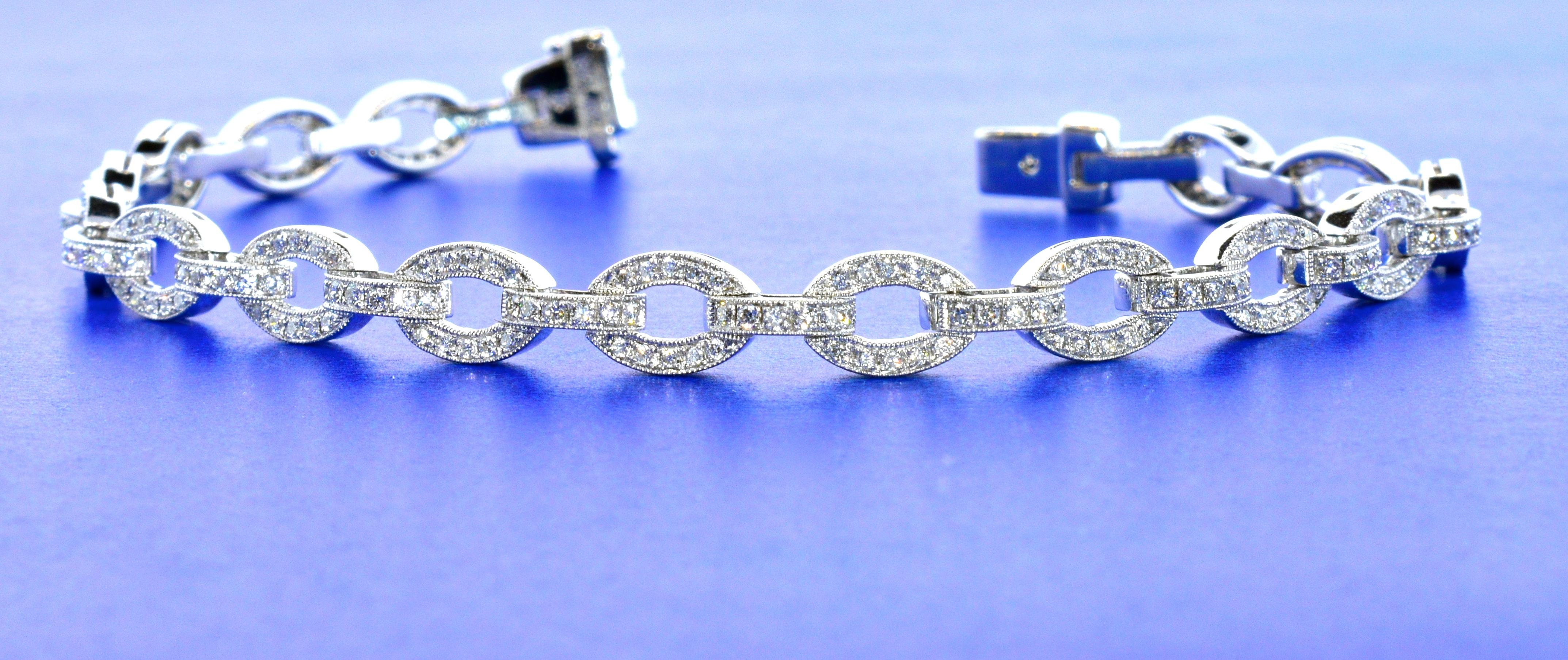 Diamond bracelet of delicate links in 18K white gold.  There are 281 small fine white diamonds amounting to approximately 1.8 cts., (H), and (VS) this easy to wear bracelet weighs 14.25 grams, and is 7 1/8th inches in length.  In fine condition,