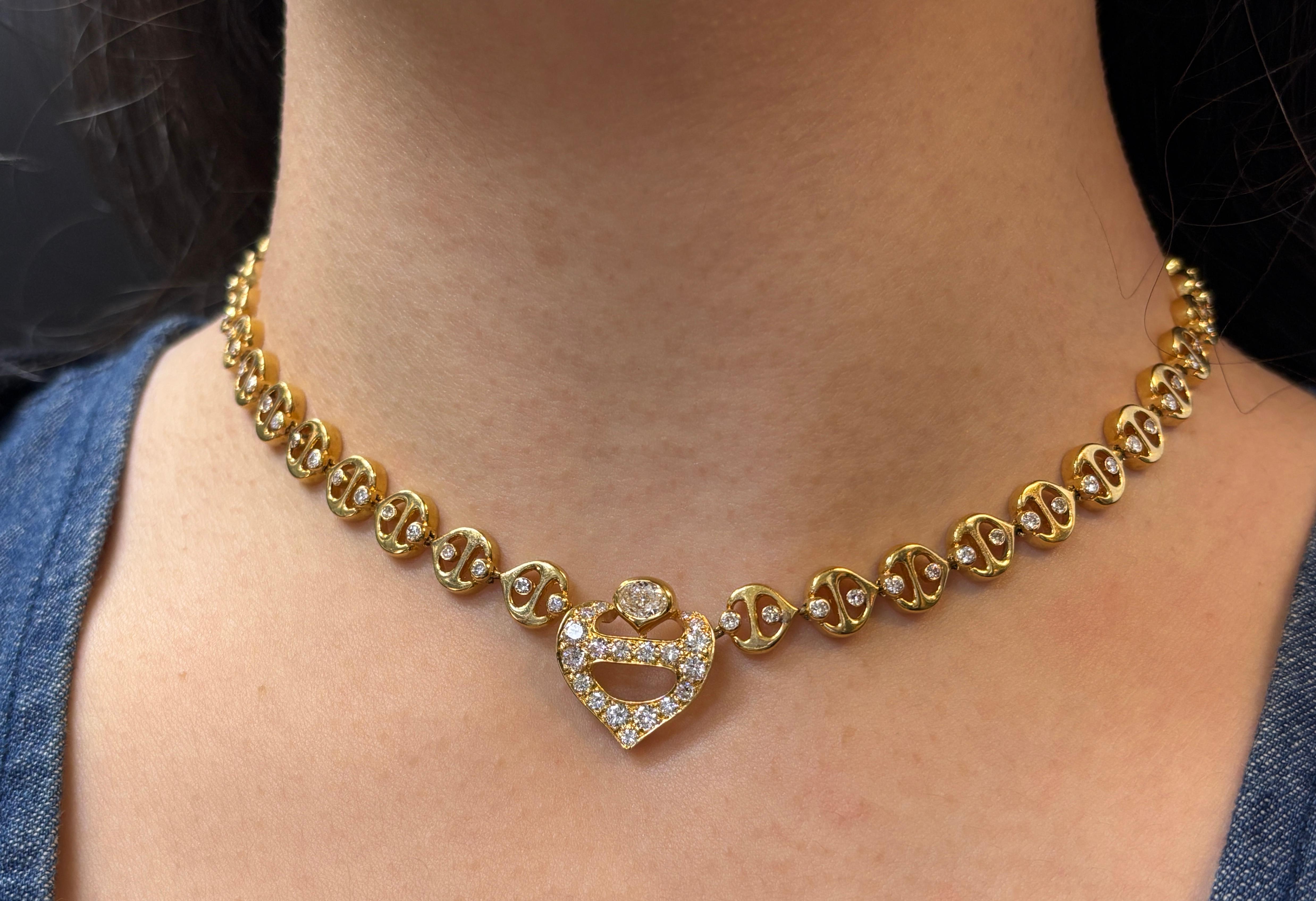 Diamond Link Necklace 

A mariner link necklace set with round cut diamonds. 

Approximate Diamond Weight: 3.30 carats 
Approximate Length: 15 inches
Made in France
Signed: C. Deneuve
Metal Type: 18 karat yellow gold 