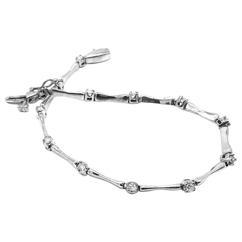 .925 Sterling Silver 1/10 Carat RoundCut Diamond "X" Link Tennis