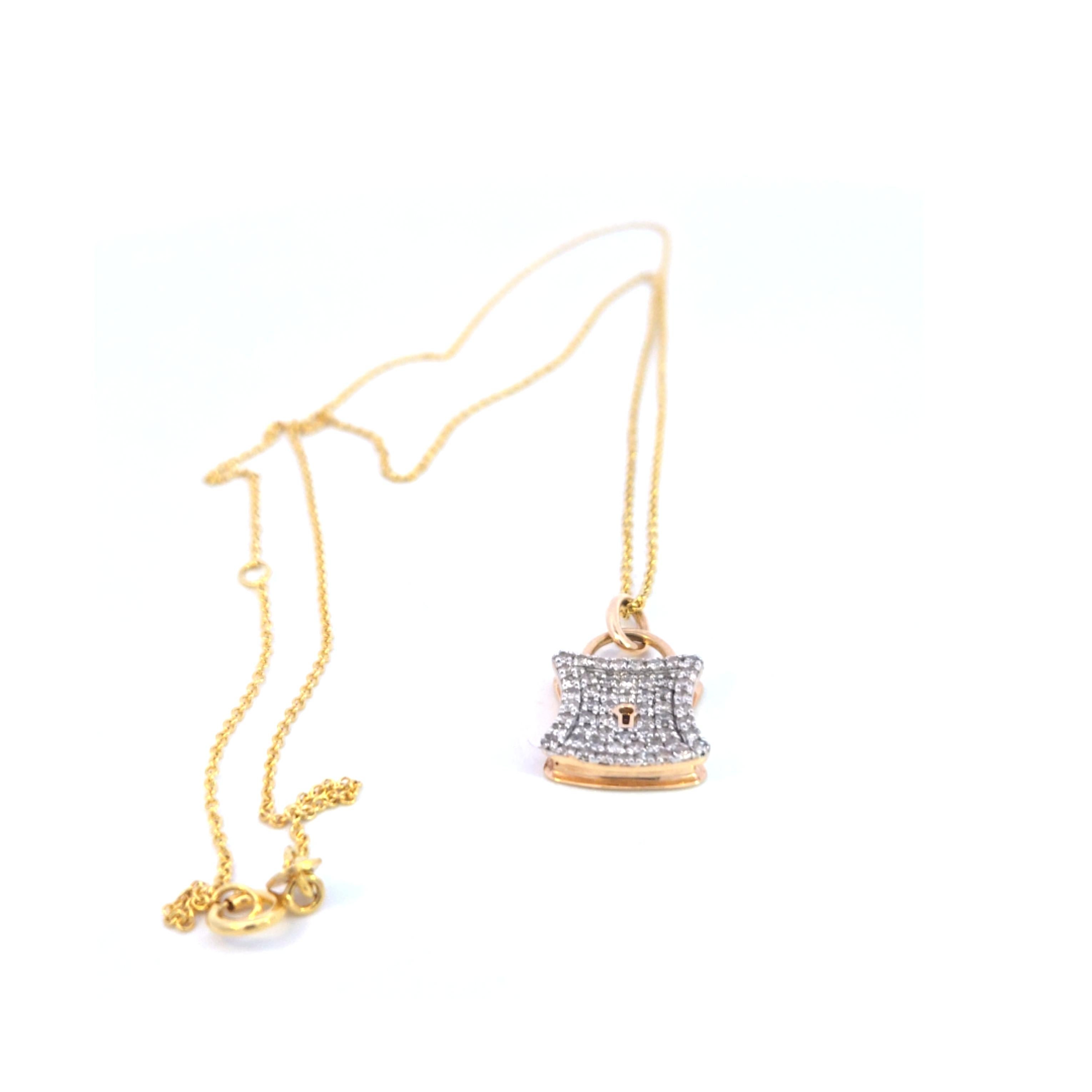 14 karat yellow gold diamond lock pendant on 20 inch chain.  This lovely pendant features 0.55 carats of diamonds and the chain can be worn from 18 to 20 inches.  This item has been professionally cleaned and polished.