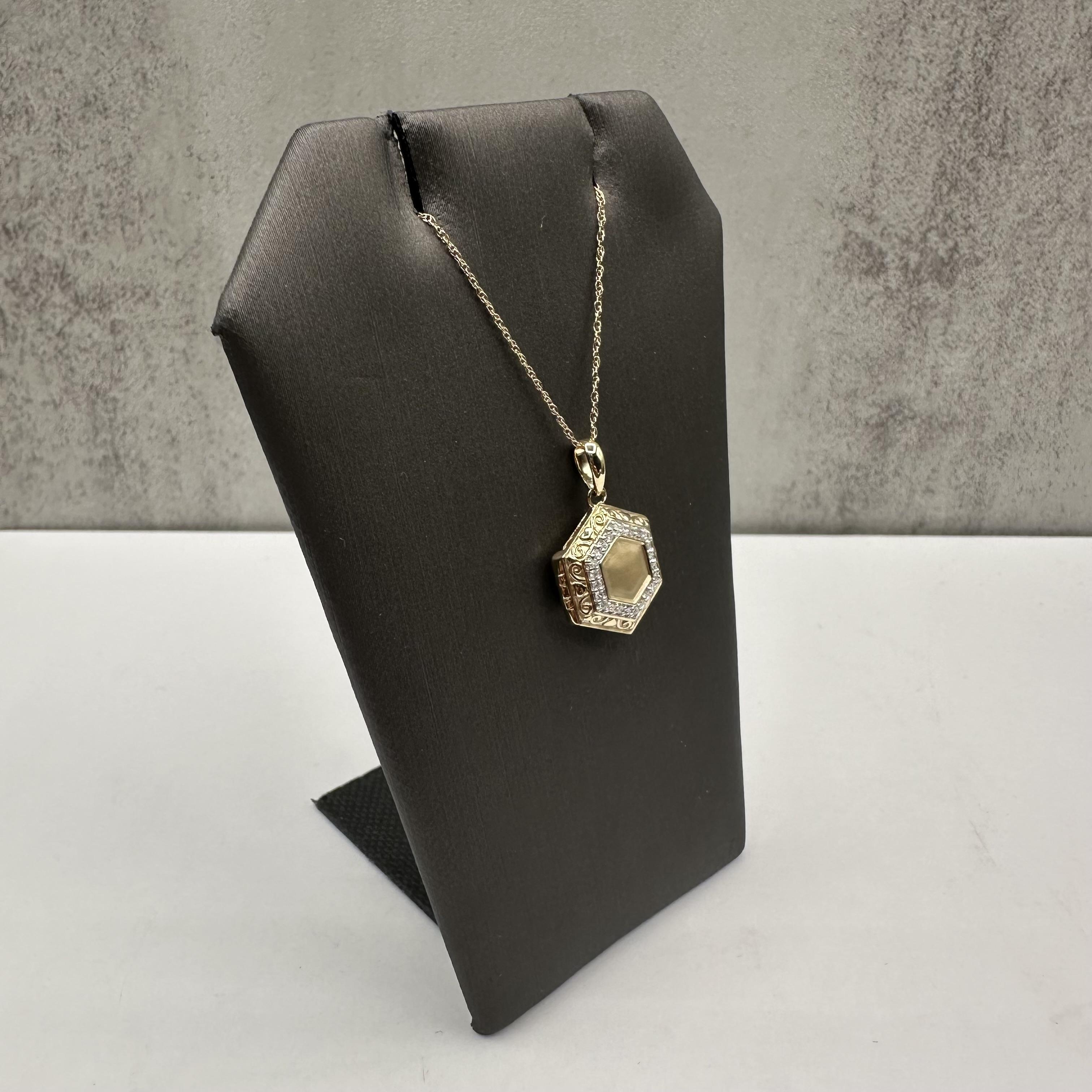 Add a meaningful touch to your collection with this elegant Diamond Locket, crafted in 10kt Yellow Gold. Featuring 0.10 carat total weight (ctw) of natural GH color, SI2-I1 clarity round single cut diamonds, this locket offers both beauty and