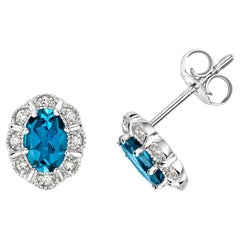 DIAMOND & LONDON BLUE TOPAZ OVAL DECO STYLE CLUSTER STUDS IN 9CT WHITE Gold